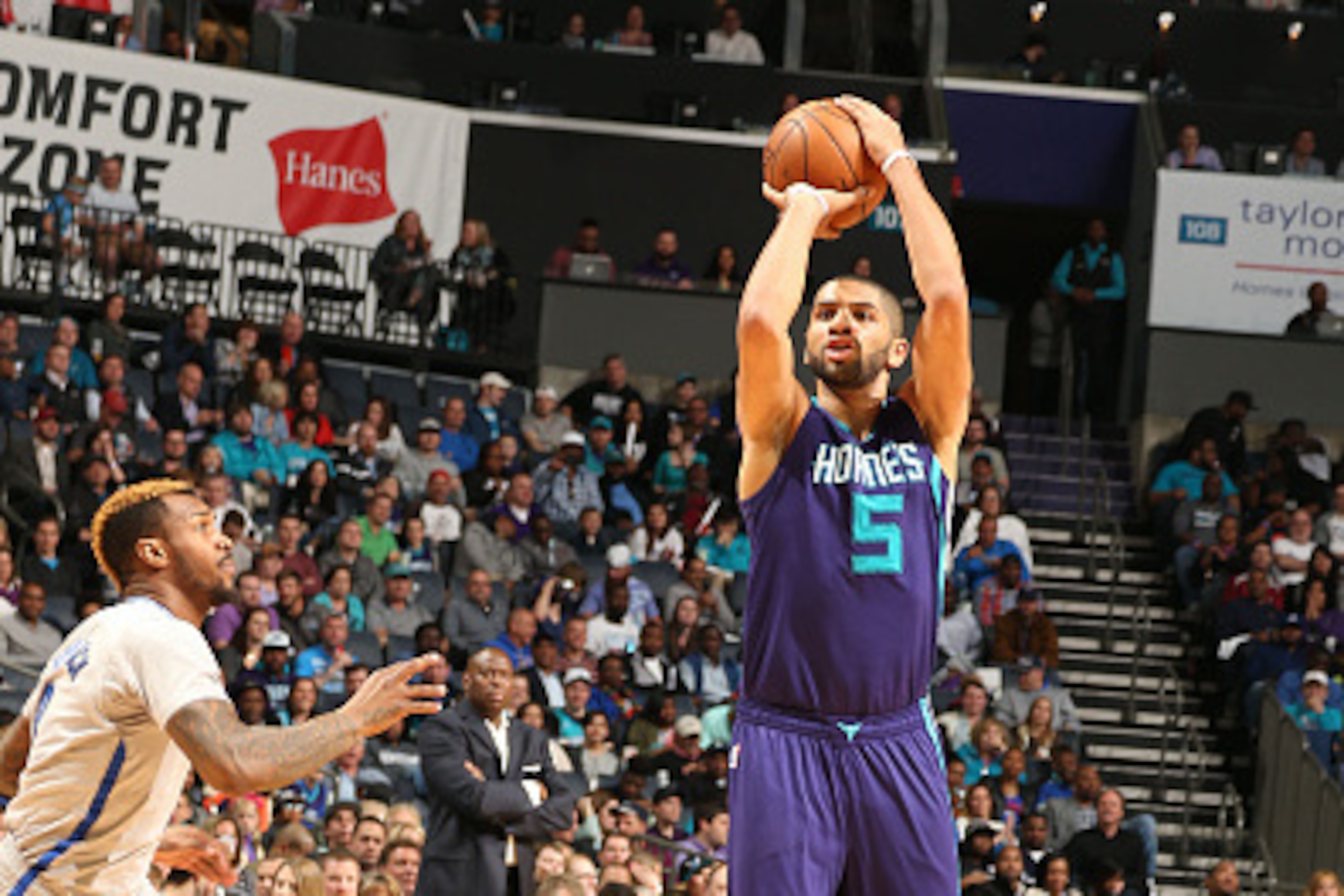 CHARLOTTE, NC  - APRIL 8: Nicolas Batum #5 of the Charlotte Hornets shoots against the Brooklyn Nets during the game on April 8, 2016 at Time Warner Cable Arena in Charlotte, North Carolina. NOTE TO USER: User expressly acknowledges and agrees that, by do