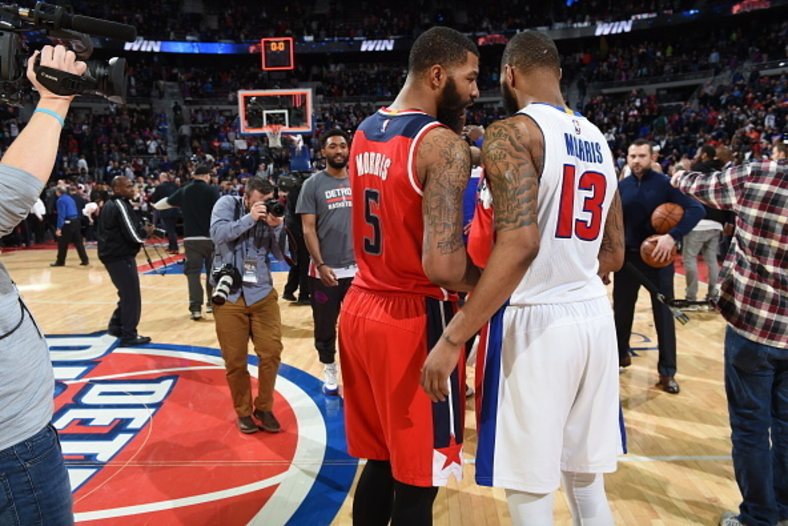 AUBURN HILLS, MI - APRIL 8:  Markieff Morris #5 of the Washington Wizards speaks with his brother Marcus Morris #13 of the Detroit Pistons after the game on April 8, 2016 at The Palace of Auburn Hills in Auburn Hills, Michigan. NOTE TO USER: User expressl