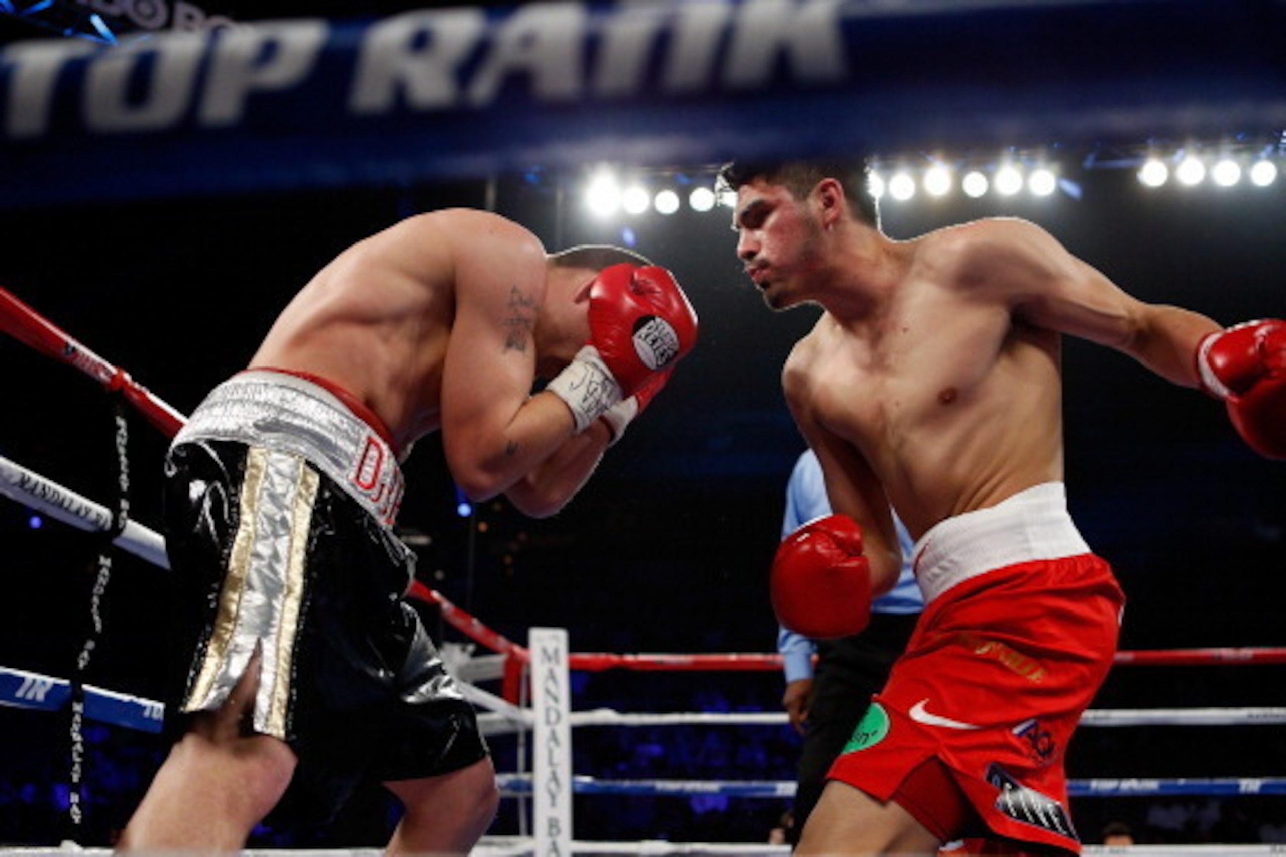LAS VEGAS, NV - MARCH 30:  (R-L) Jose Carlos Ramirez prepares to throw a left to the body of Charlie Dubray in their lightweight bout at the Mandalay Bay Events Center on March 30, 2013 in Las Vegas, Nevada. (Photo by Josh Hedges/Getty Images)