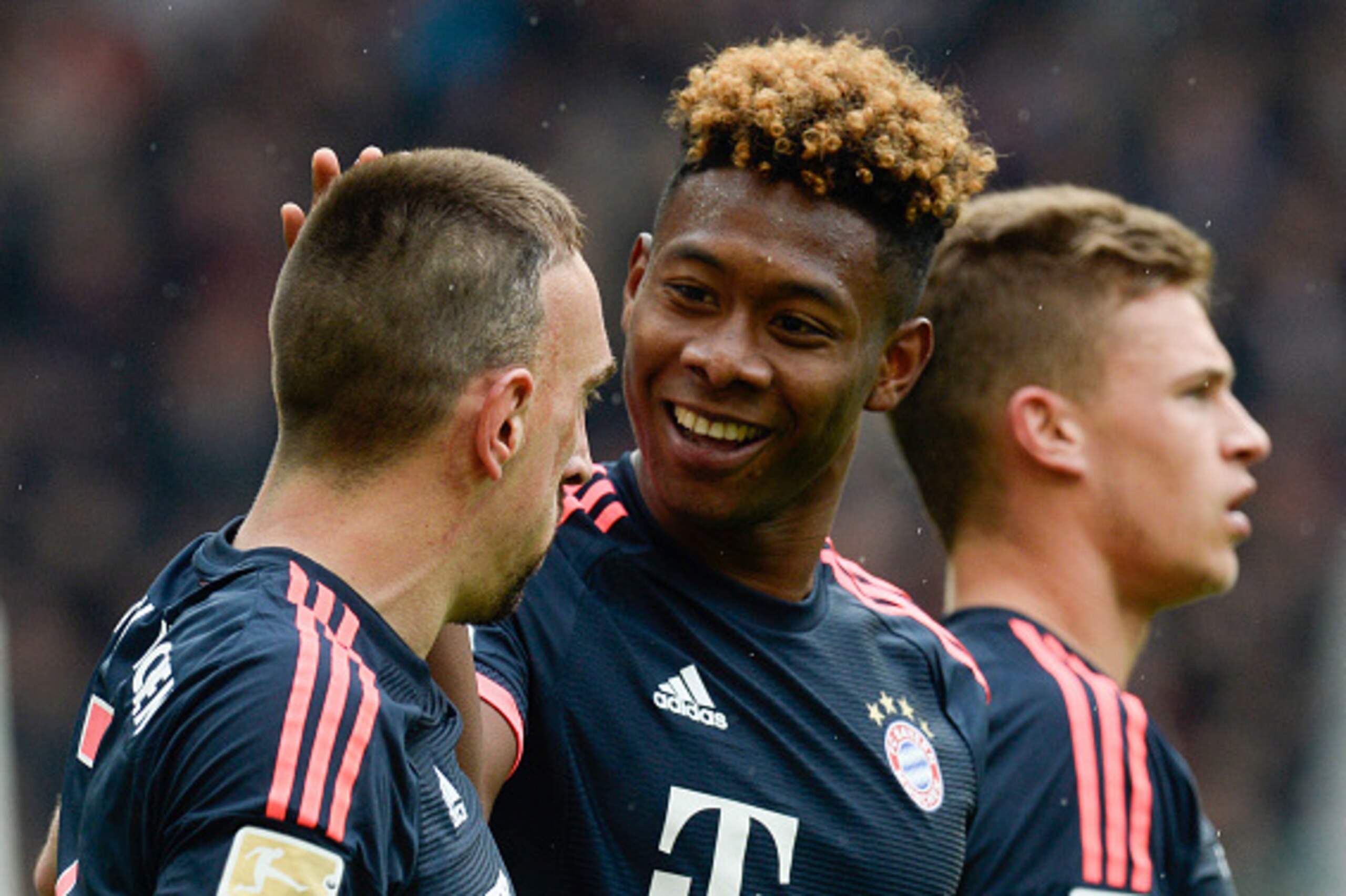 (L-R) Bayern Munich's French midfielder Franck Ribery, Austrian defender David Alaba and midfielder Joshua Kimmich react after Alaba scored during the German Bundesliga first division football match between VFB Stuttgart and FC Bayern Munich in Munich, so