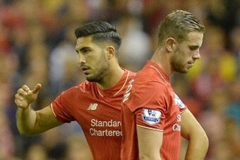 Liverpool's English midfielder Jordan Henderson (R) is substituted by Liverpool's German midfielder Emre Can during the English Premier League football match between Liverpool and Bournemouth at the Anfield stadium in Liverpool, north-west England on Augu