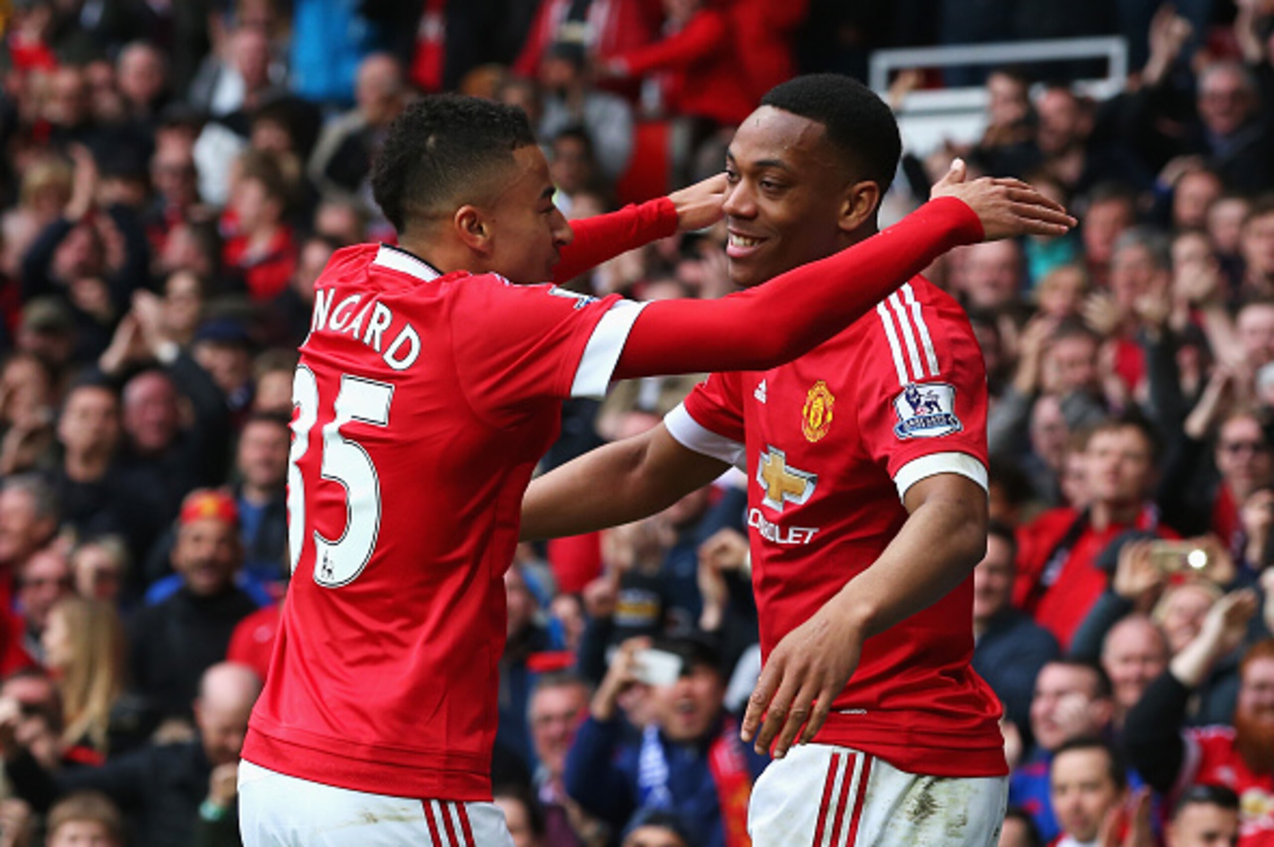 MANCHESTER, ENGLAND - APRIL 03:  Anthony Martial of Manchester United (R) celebrates with Jesse Lingard (L) as he scores their first goal during the Barclays Premier League match between Manchester United and Everton at Old Trafford on April 3, 2016 in Ma