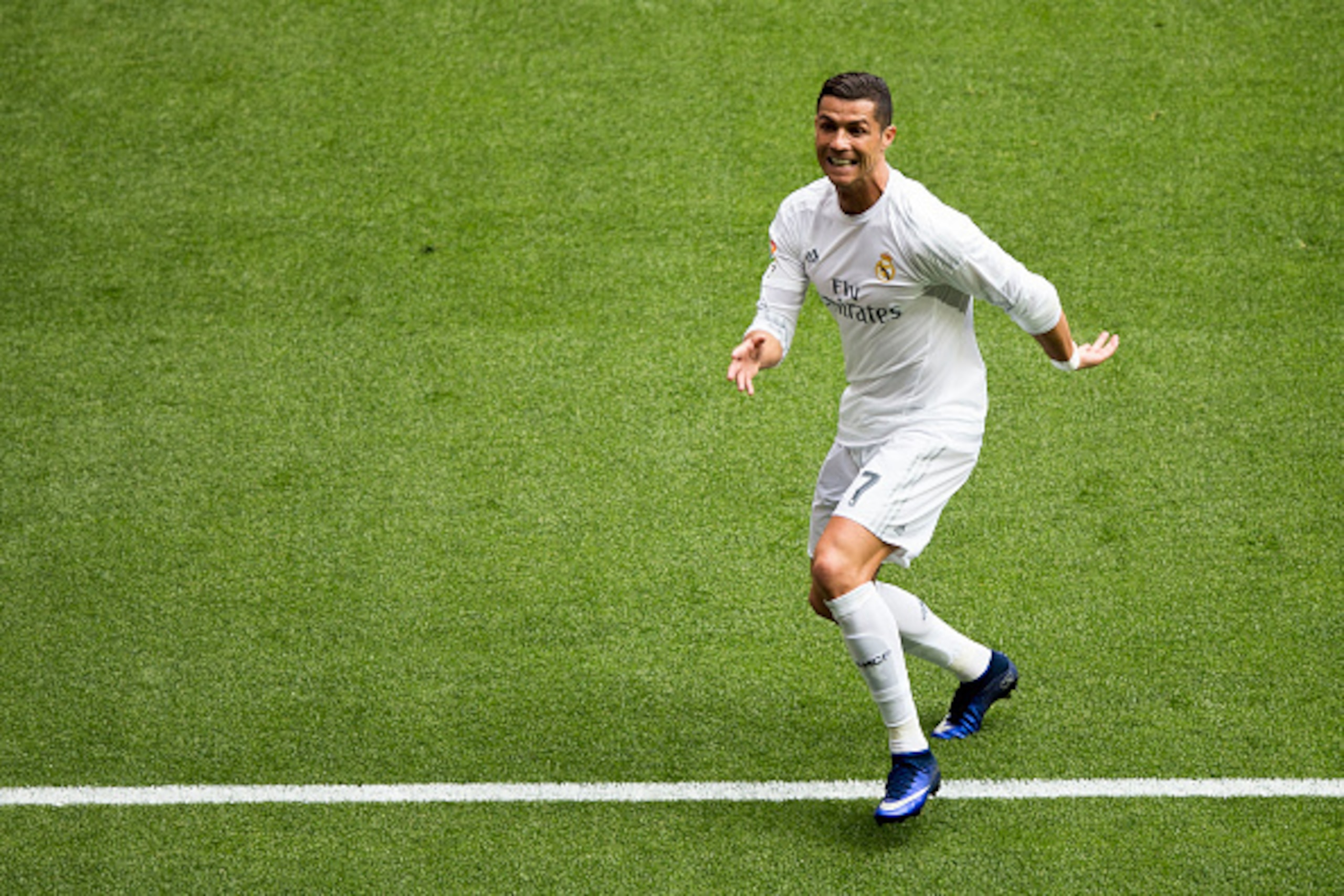MADRID, SPAIN - APRIL 09:  Cristiano Ronaldo (R) of Real Madrid CF celebrates scoring their third goal during the La Liga match between Real Madrid CF and SD Eibar at Estadio Santiago Bernabeu on April 9, 2016 in Madrid, Spain.  (Photo by Gonzalo Arroyo M