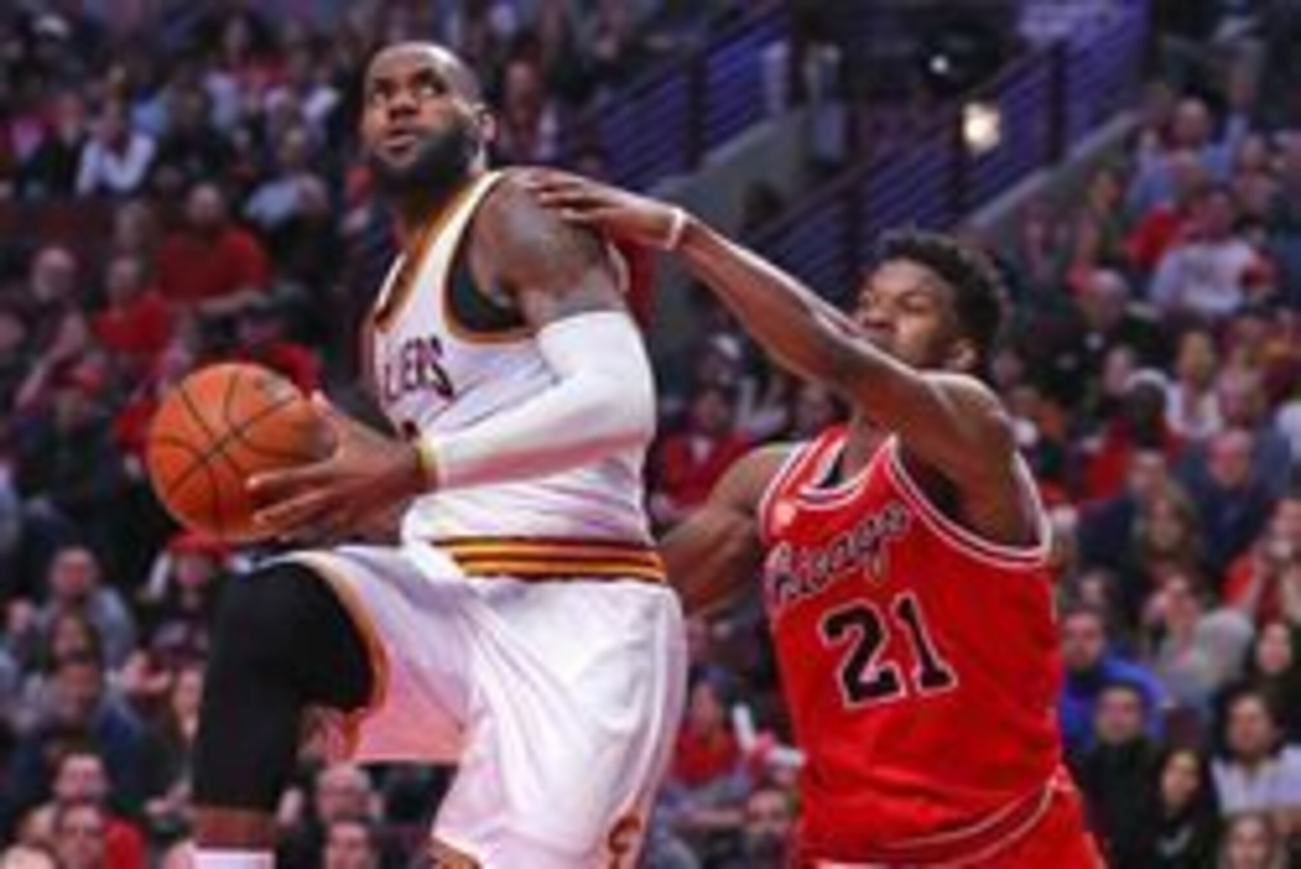 Apr 9, 2016; Chicago, IL, USA; Cleveland Cavaliers forward LeBron James (23) is fouled by Chicago Bulls guard Jimmy Butler (21) during the second half at the United Center. Chicago won 105-102. Mandatory Credit: Dennis Wierzbicki-USA TODAY Sports