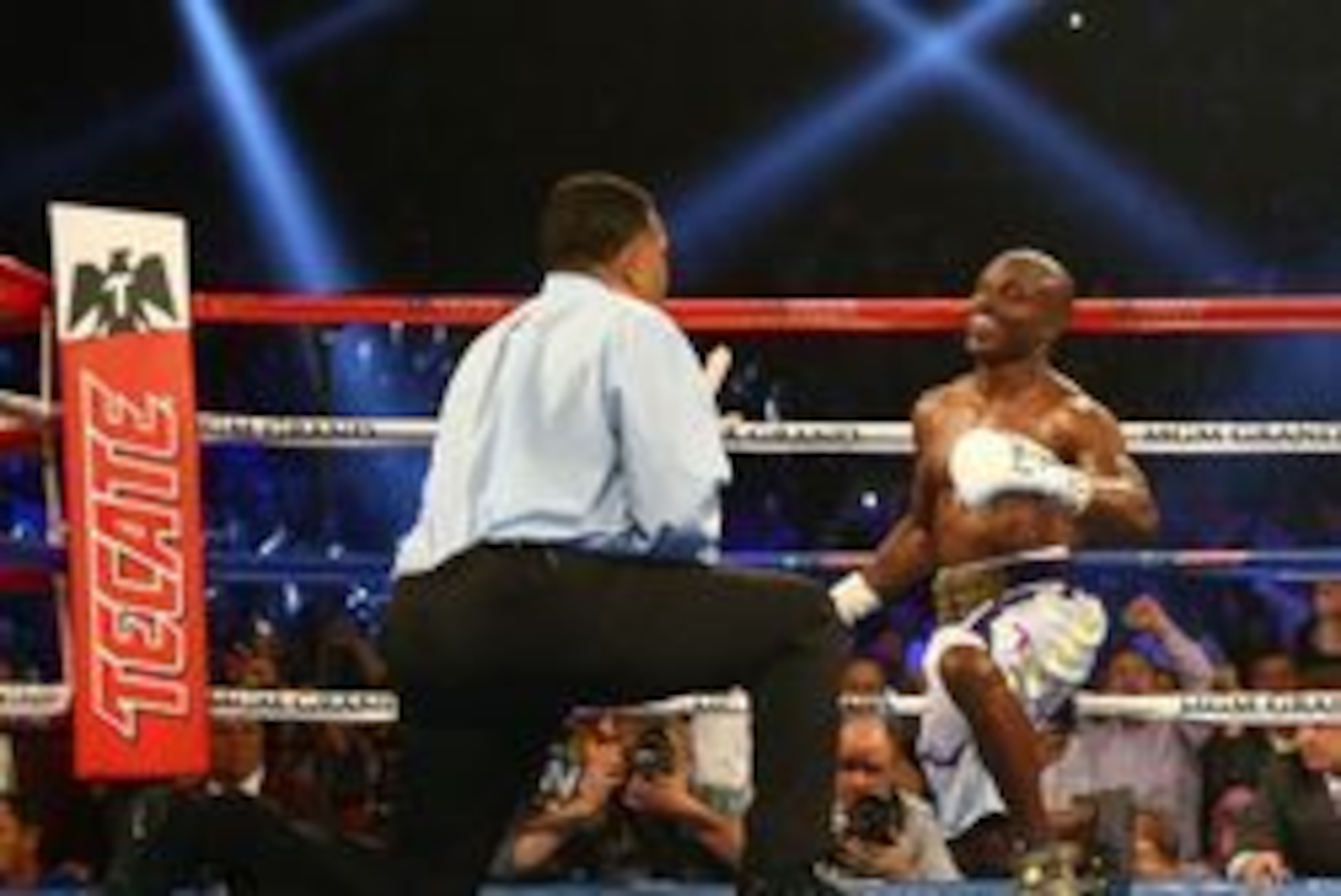 April 9, 2016; Las Vegas, NV, USA; Referee Tony Weeks counts as Timothy Bradley gets up after being brought down by Manny Pacquiao at MGM Grand Garden Arena. Mandatory Credit: Mark J. Rebilas-USA TODAY Sports