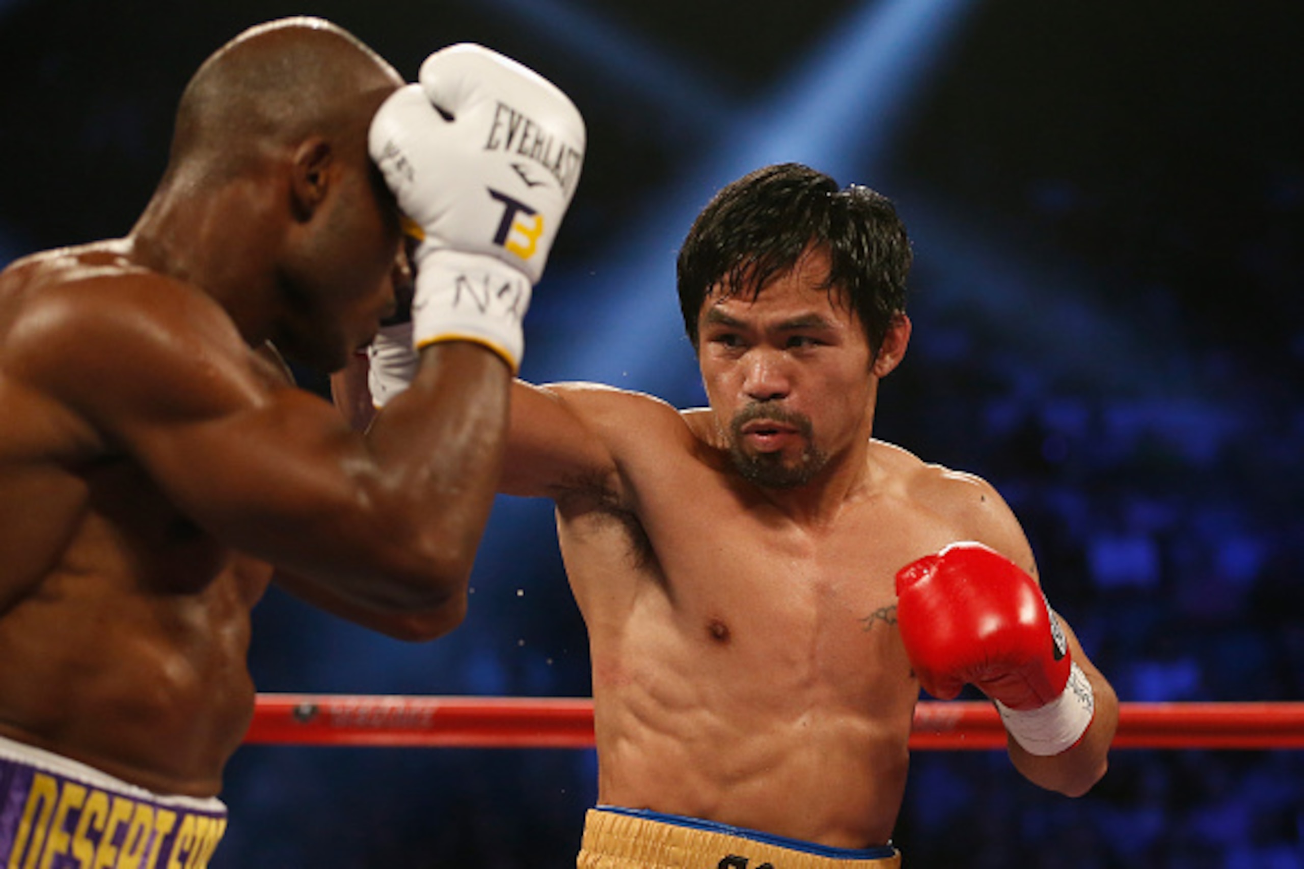 LAS VEGAS, NEVADA - APRIL 09:  Manny Pacquiao punches Timothy Bradley Jr. during their welterweight championship fight on April 9, 2016 at MGM Grand Garden Arena in Las Vegas, Nevada. Pacquiao won by unanimous decision.  (Photo by Christian Petersen/Getty