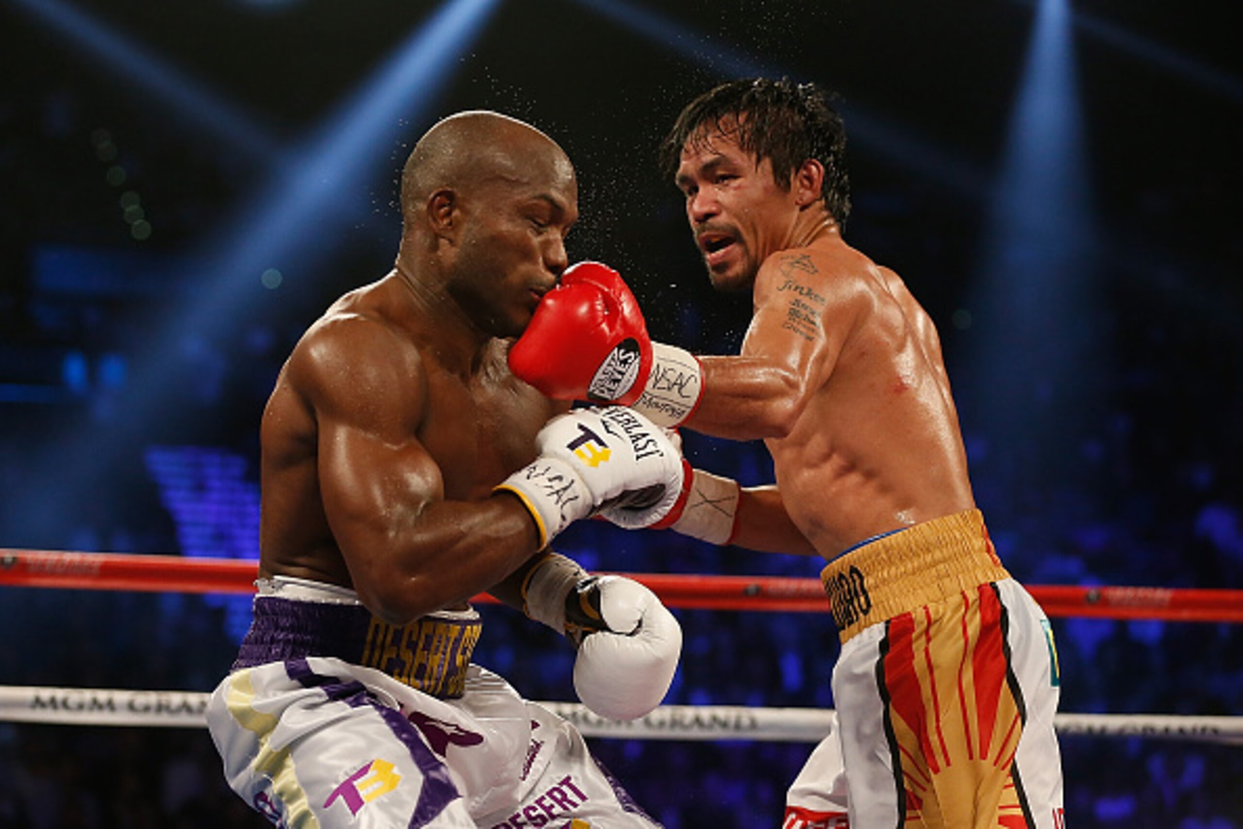 LAS VEGAS, NEVADA - APRIL 09:  Manny Pacquiao (R) lands a left to the chin of Timothy Bradley Jr. during their welterweight championship fight on April 9, 2016 at MGM Grand Garden Arena in Las Vegas, Nevada. Pacquiao won by unaimous decision.  (Photo by C