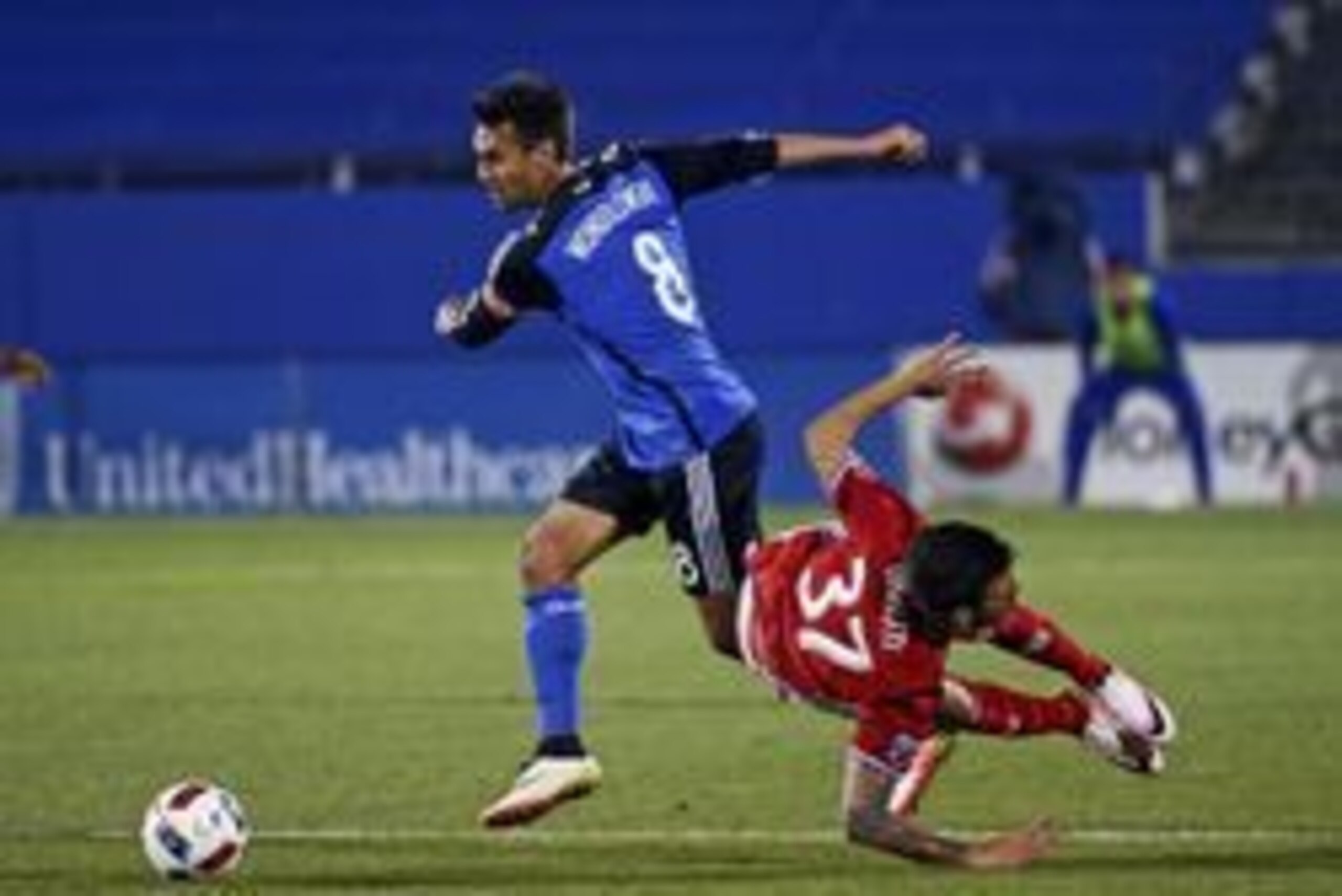 Apr 9, 2016; Dallas, TX, USA; San Jose Earthquakes forward Chris Wondolowski (8) fouls FC Dallas forward Maximiliano Urruti (37) during the second half at Toyota Stadium. Mandatory Credit: Kevin Jairaj-USA TODAY Sports