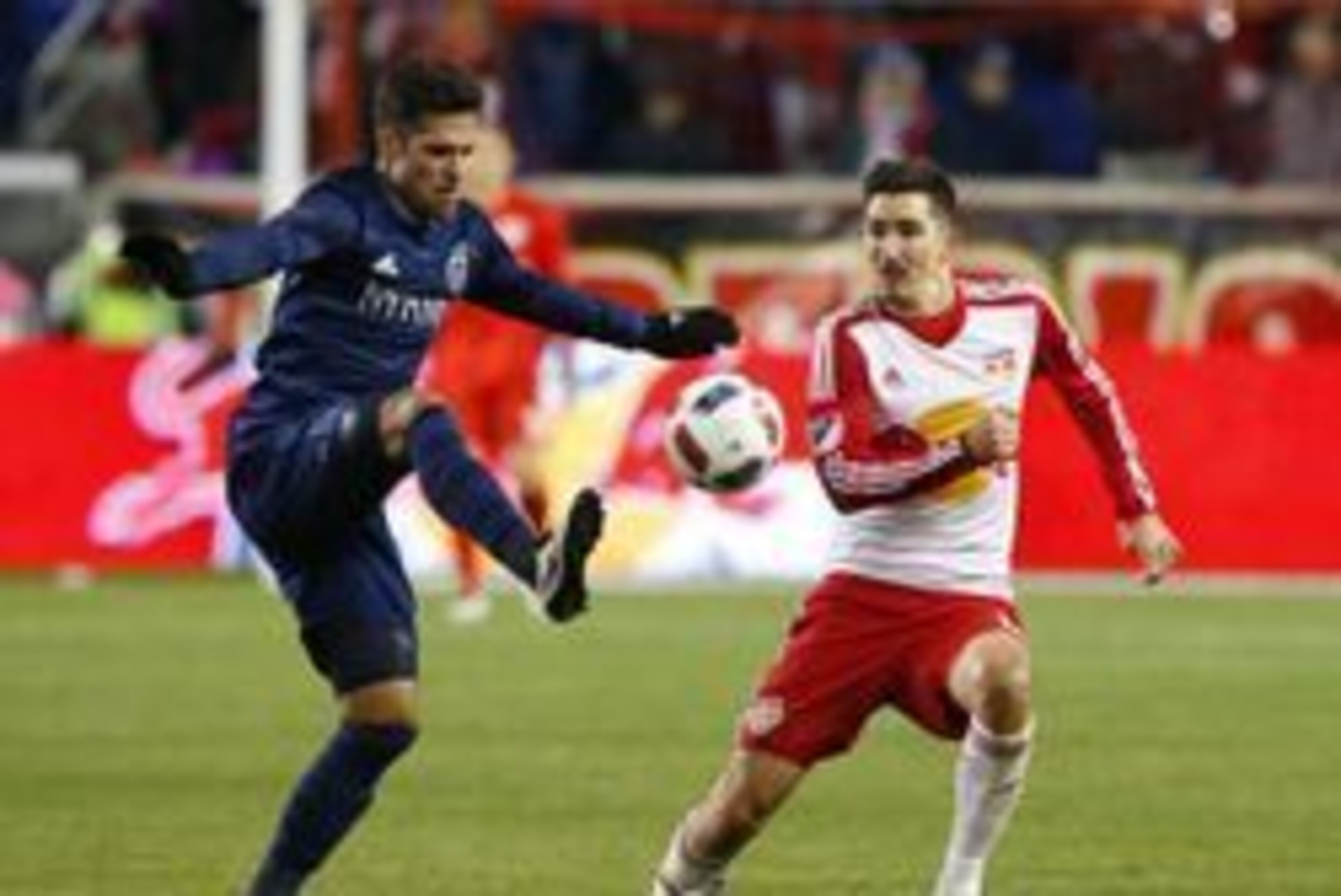 Apr 9, 2016; Harrison, NJ, USA; New York Red Bulls midfielder Sacha Kljestan (16) defends against Sporting Kansas City midfielder Benny Feilhaber (10) during first half at Red Bull Arena. Mandatory Credit: Noah K. Murray-USA TODAY Sports