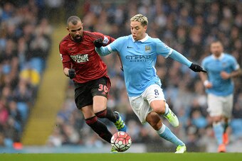 MANCHESTER, ENGLAND - APRIL 09:  Samir Nasri of Manchester City and Sandro of West Bromwich Albion compete for the ball during the Barclays Premier League match between Manchester City and West Bromwich Albion at the Etihad Stadium on April 9, 2016 in Man