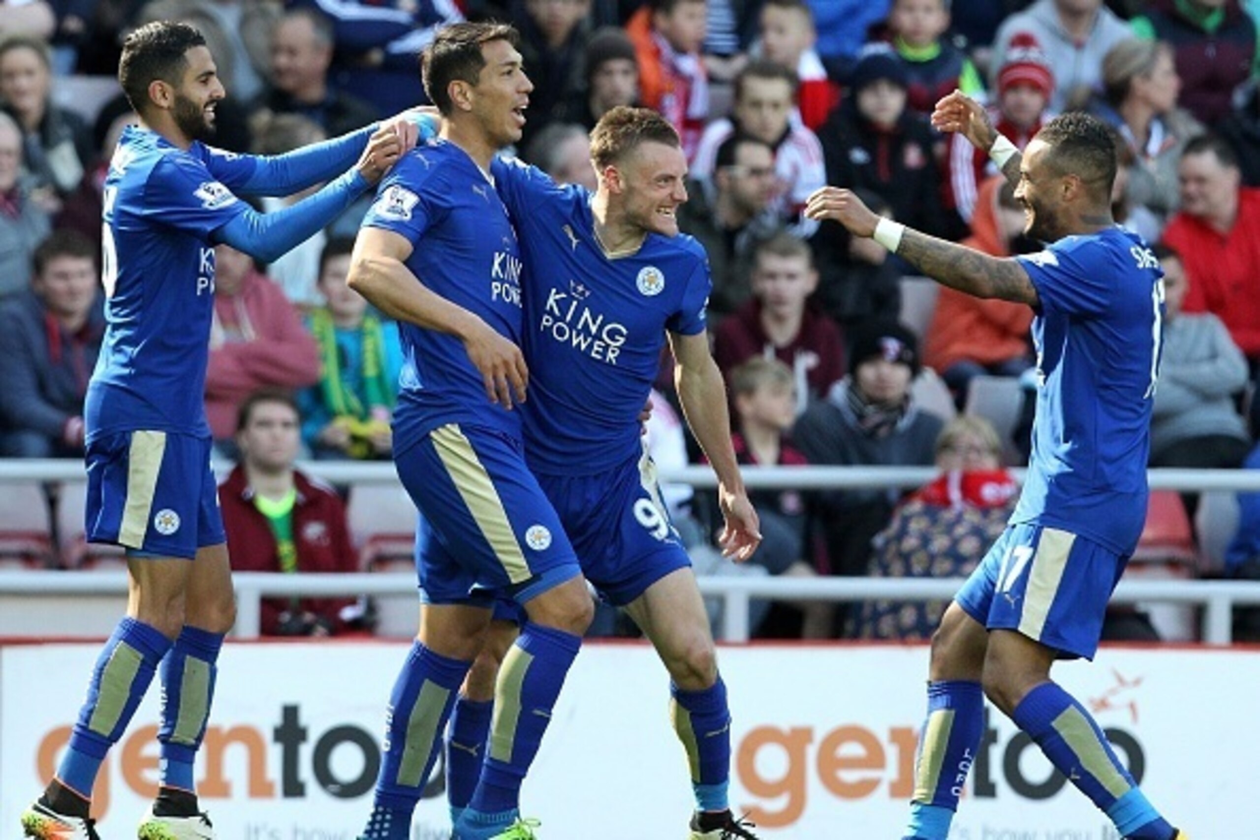 Leicester City's English striker Jamie Vardy (2R) celebrates scoring his team's first goal with Leicester City's Argentinian striker Leonardo Ulloa (2L), and Leicester City's Algerian midfielder Riyad Mahrez (L) and Leicester City's English defender Danny Leicester City's English striker Jamie Vardy (2R) celebrates scoring his team's first goal with Leicester City's Argentinian striker Leonardo Ulloa (2L), and Leicester City's Algerian midfielder Riyad Mahrez (L) and Leicester City's English defender Danny