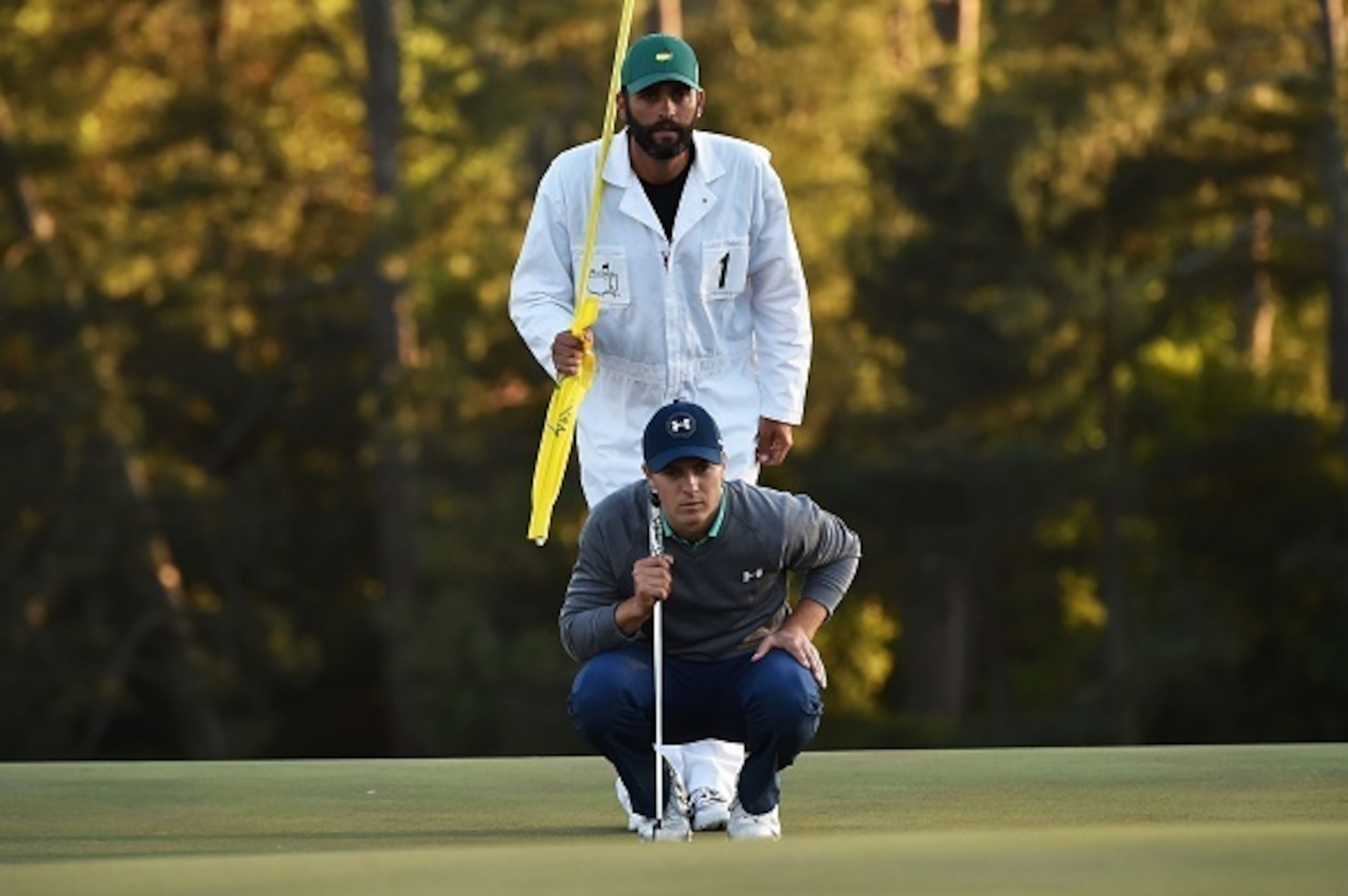 US golfer Jordan Spieth lines up putt on the 18th green during Round 3 of the 80th Masters Golf Tournament at the Augusta National Golf Club on April 9, 2016, in Augusta, Georgia. / AFP / Nicholas Kamm        (Photo credit should read NICHOLAS KAMM/AFP/Ge