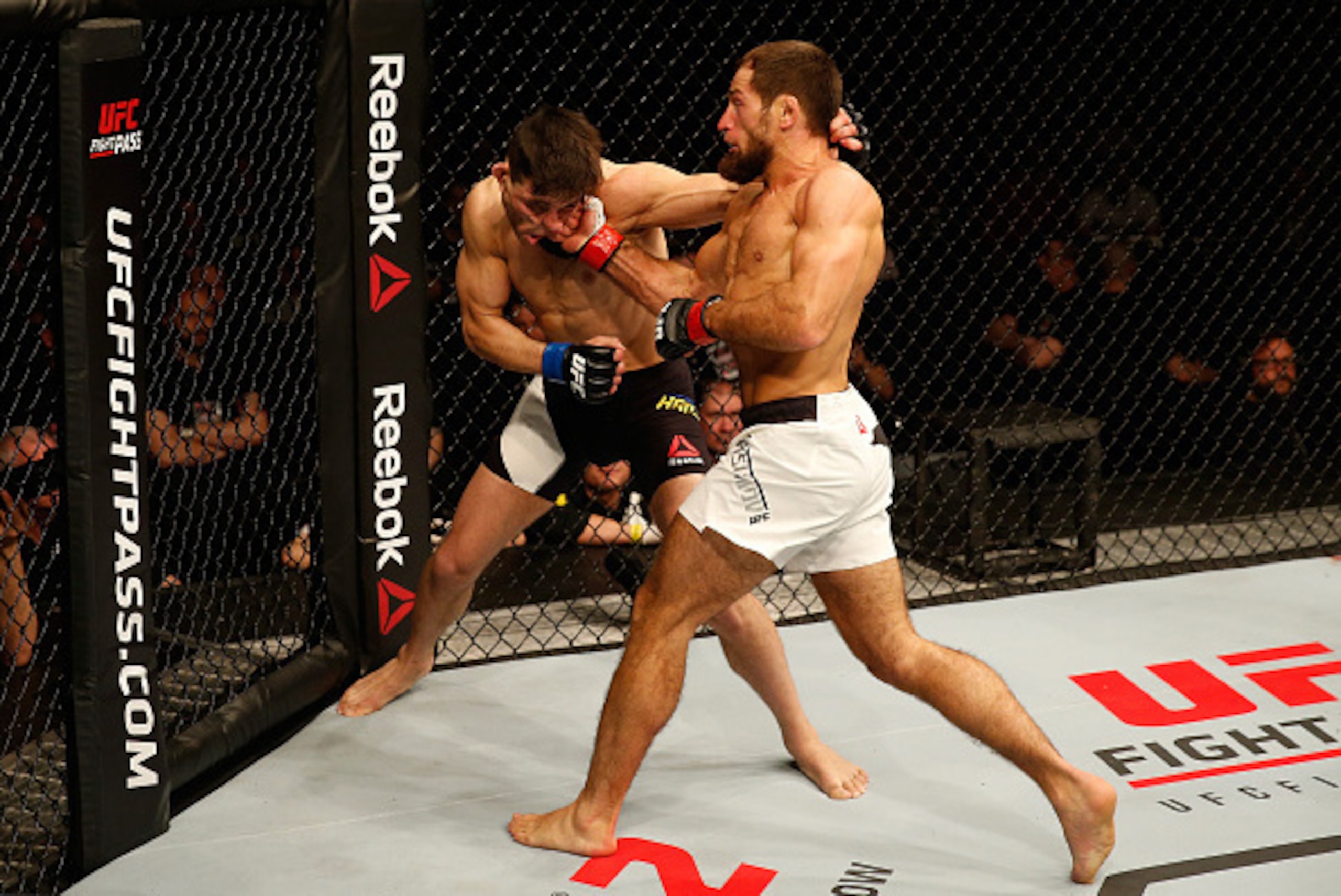 ZAGREB, CROATIA - APRIL 10:   (R-L) Mairbek Taisumov punches Damir Hadzovic in their lightweight bout during the UFC Fight Night event at the Arena Zagreb on April 10, 2016 in Zagreb, Croatia. (Photo by Srdjan Stevanovic/Zuffa LLC/Zuffa LLC via Getty Imag