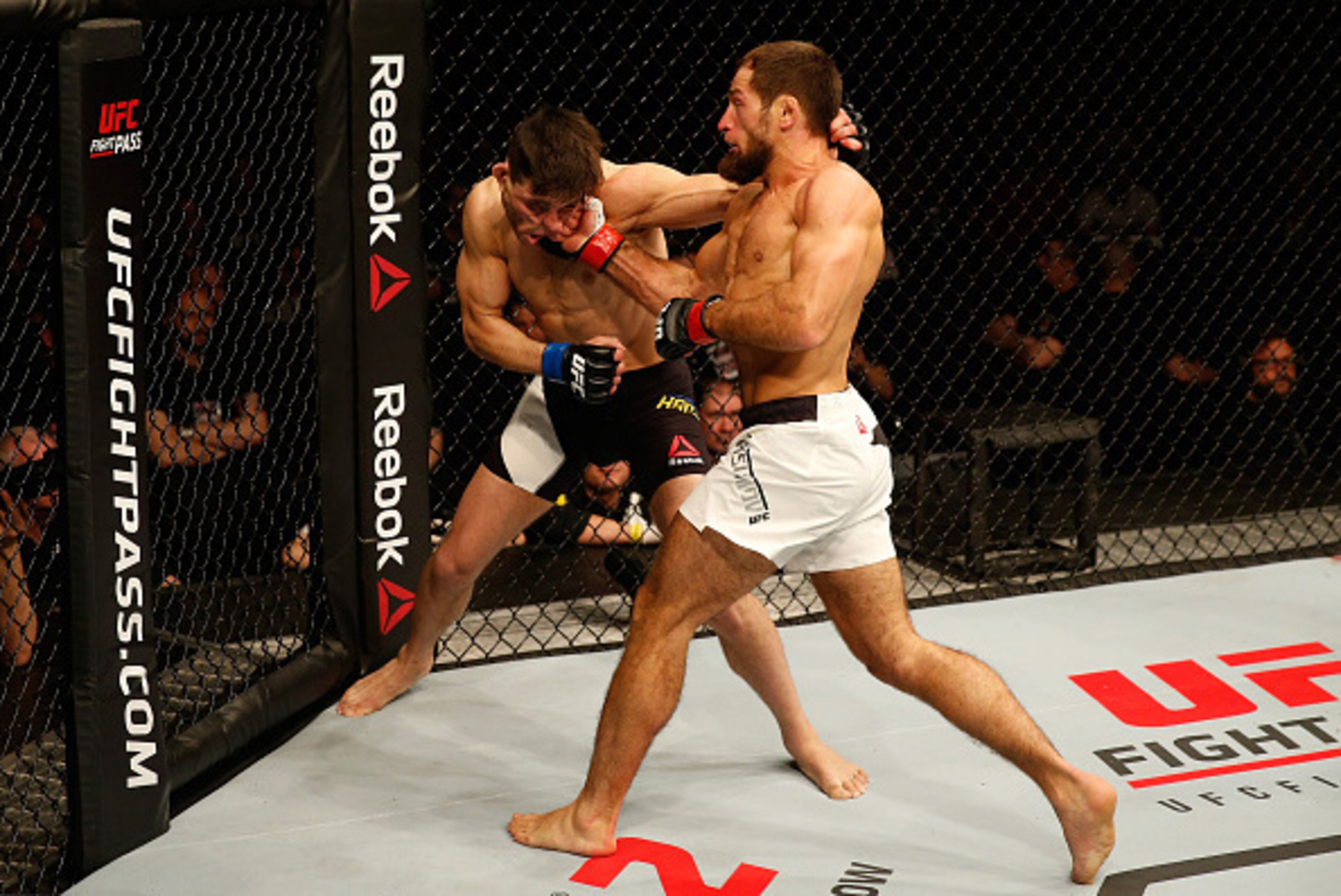 ZAGREB, CROATIA - APRIL 10:   (R-L) Mairbek Taisumov punches Damir Hadzovic in their lightweight bout during the UFC Fight Night event at the Arena Zagreb on April 10, 2016 in Zagreb, Croatia. (Photo by Srdjan Stevanovic/Zuffa LLC/Zuffa LLC via Getty Imag