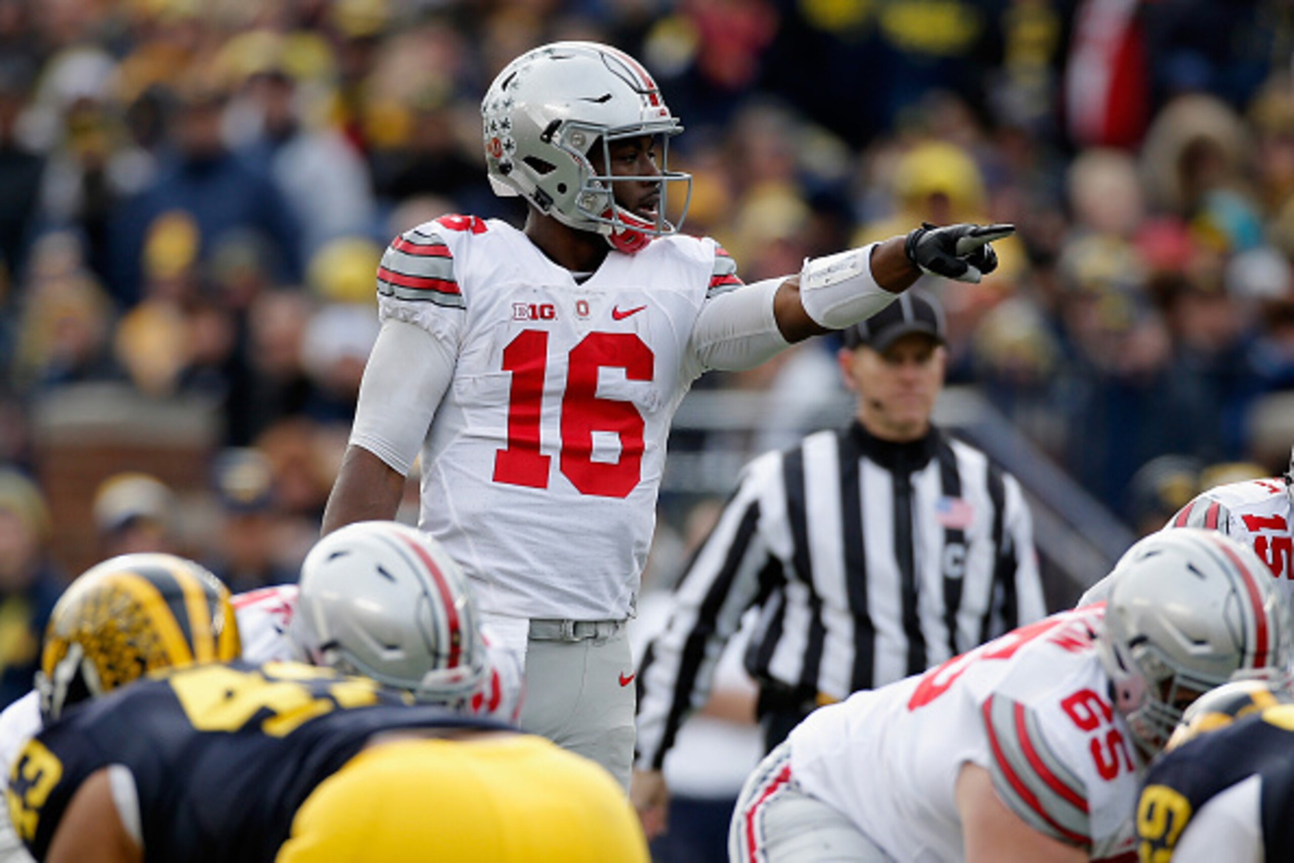 ANN ARBOR, MI - NOVEMBER 28: Quarterback J.T. Barrett #16 of the Ohio State Buckeyes motions from the line of scrimmage against the Michigan Wolverines in the third quarter at Michigan Stadium on November 28, 2015 in Ann Arbor, Michigan.  (Photo by Gregor