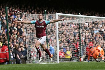 Andy Carroll proved unplayable as his hat-trick for West Ham all but ended Arsenal's title hopes.
