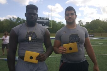 Offensive linemen Alex Leatherwood (left) and Nick Brahms