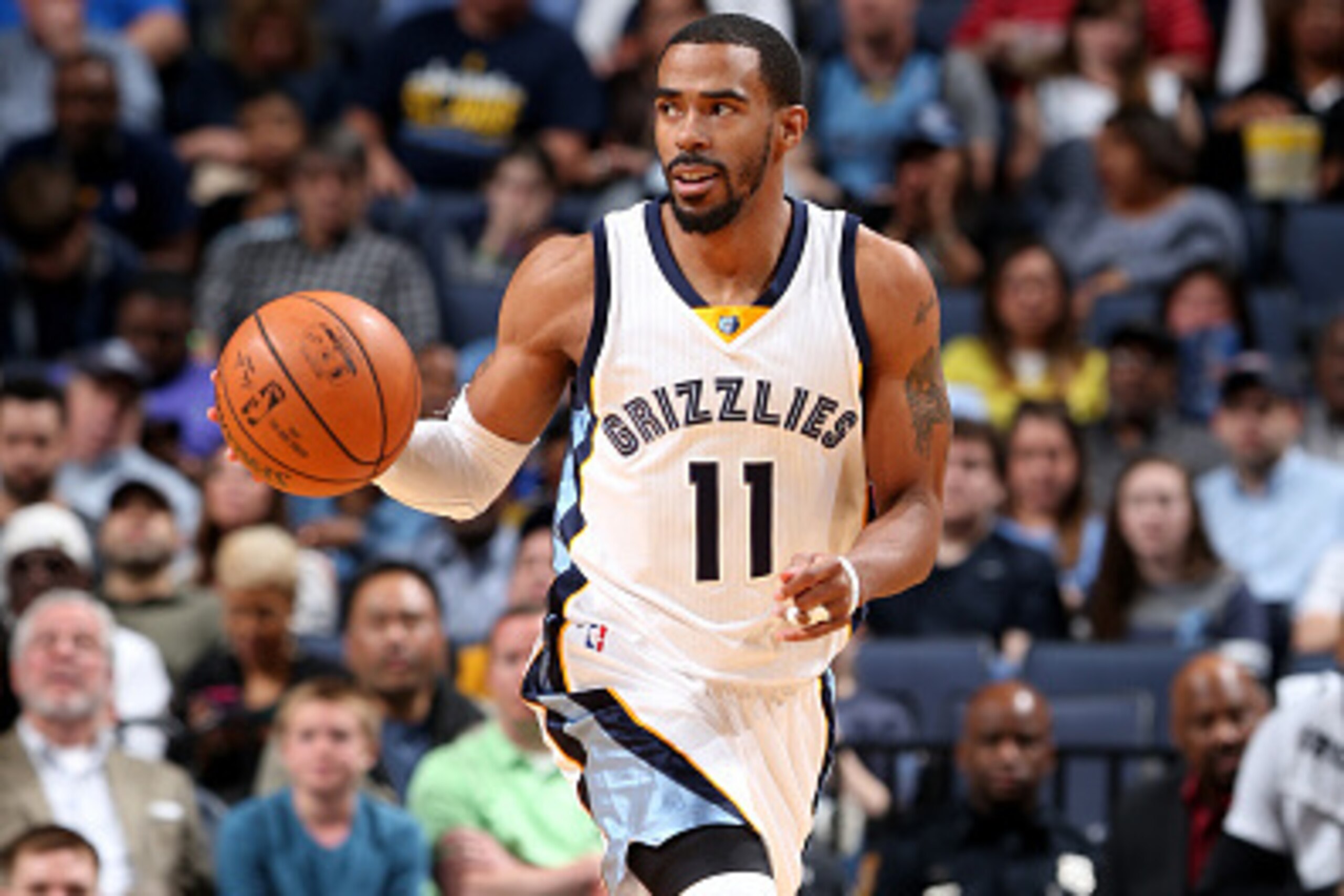 MEMPHIS, TN - MARCH 6: Mike Conley #11 of the Memphis Grizzlies handles the ball during the game against the Phoenix Suns on March 6, 2016 at FedExForum in Memphis, Tennessee. NOTE TO USER: User expressly acknowledges and agrees that, by downloading and o