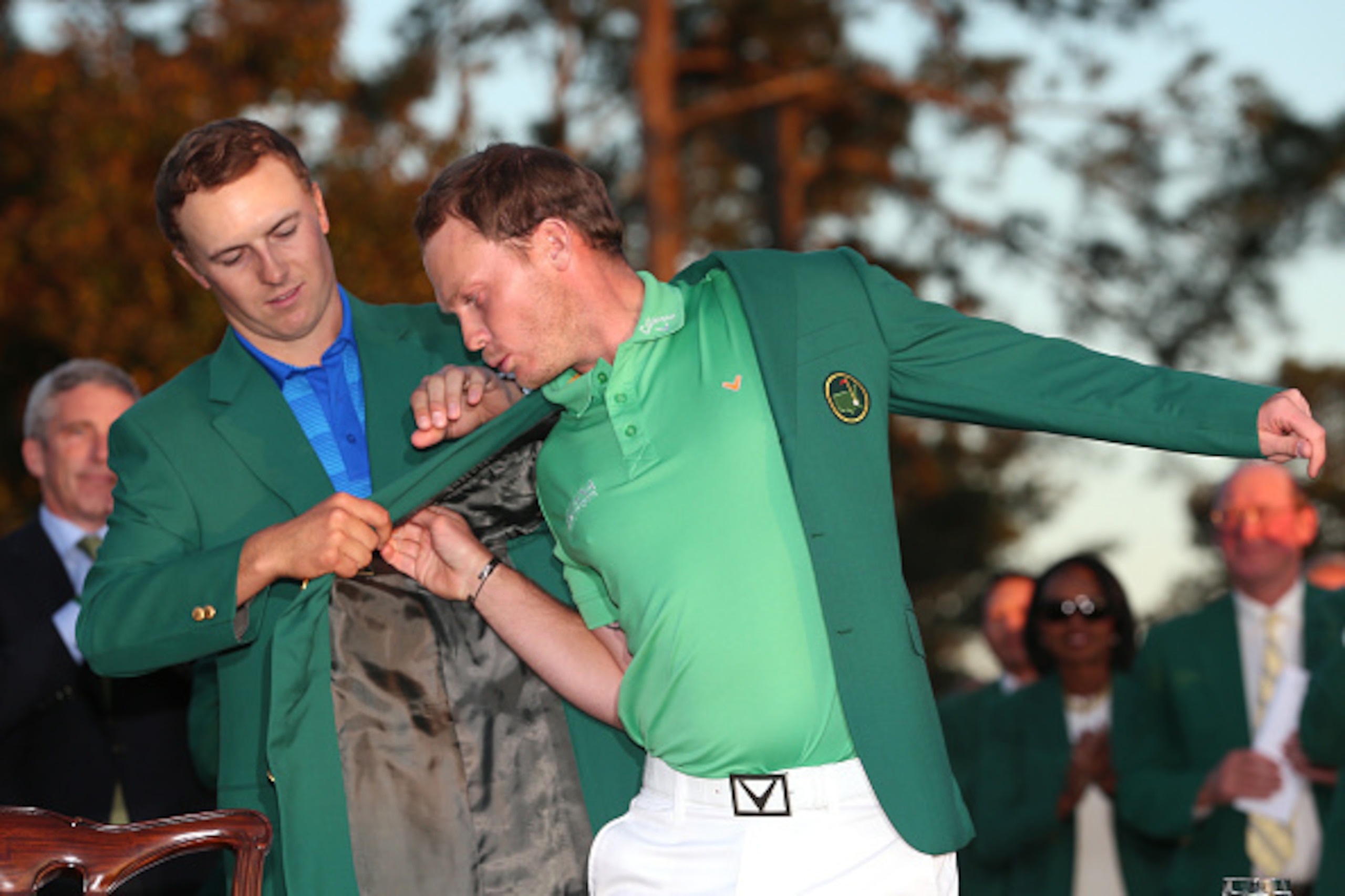 AUGUSTA, GEORGIA - APRIL 10:  Jordan Spieth of the United States presents Danny Willett of England with the green jacket after Willett won the final round of the 2016 Masters Tournament at Augusta National Golf Club on April 10, 2016 in Augusta, Georgia. 