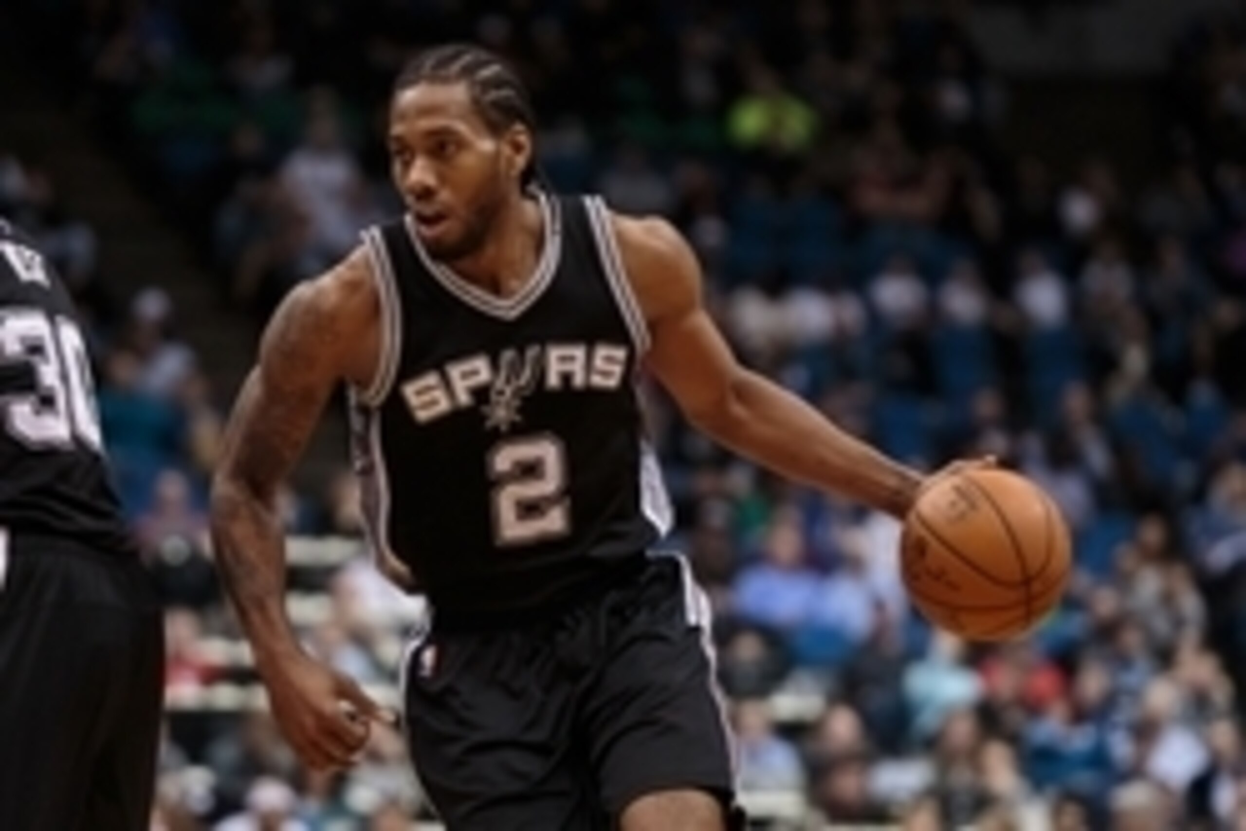 Mar 8, 2016; Minneapolis, MN, USA; San Antonio Spurs forward Kawhi Leonard (2) dribbles in the third quarter against the Minnesota Timberwolves at Target Center. The San Antonio Spurs beat the Minnesota Timberwolves 116-91. Mandatory Credit: Brad Rempel-U