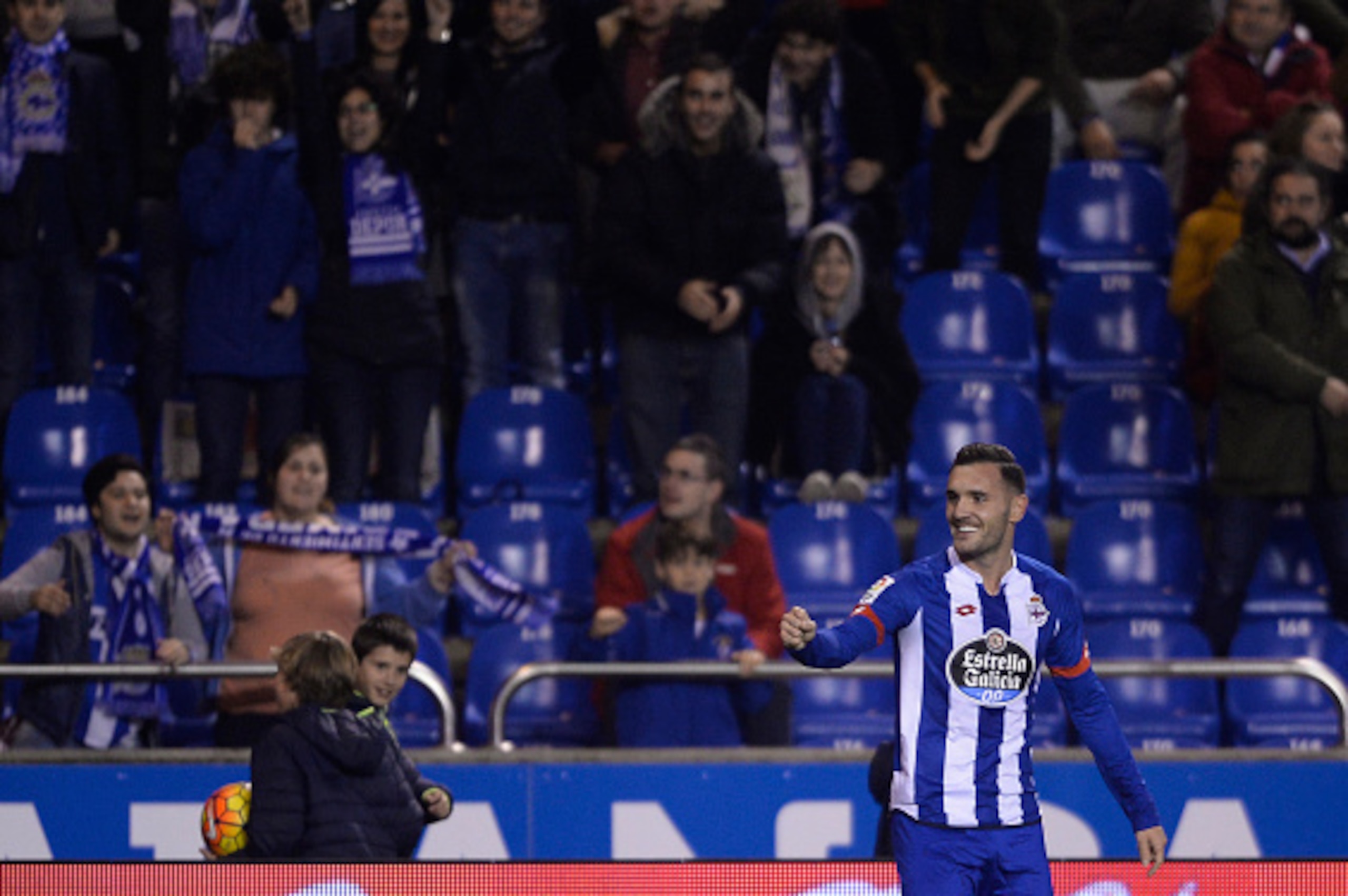 Deportivo La Coruna's midfielder Lucas Perez celebrates a goal during the Spanish league football match RC Deportivo de la Coruna vs Sevilla FC at the Municipal de Riazor stadium in La Coruna on December 5, 2015.   AFP PHOTO / MIGUEL RIOPA / AFP / MIGUEL 