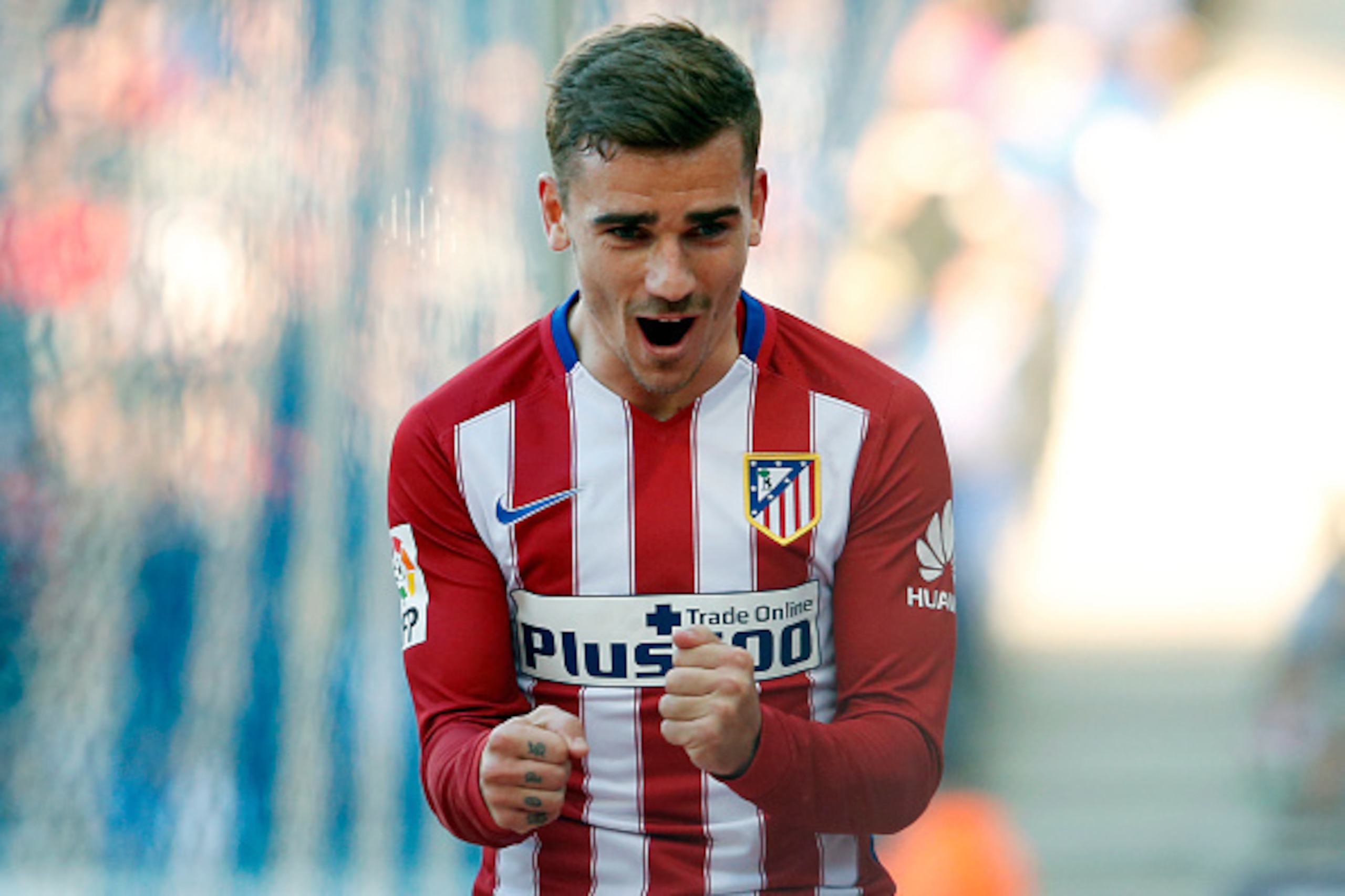 Atletico Madrid's French forward Antoine Griezmann celebrates a goal during the Spanish league football match RCD Espanyol vs Club Atletico de Madrid at the Cornella-El Prat stadium in Cornella de Llobregat on April 9, 2016. / AFP / PAU BARRENA        (Ph