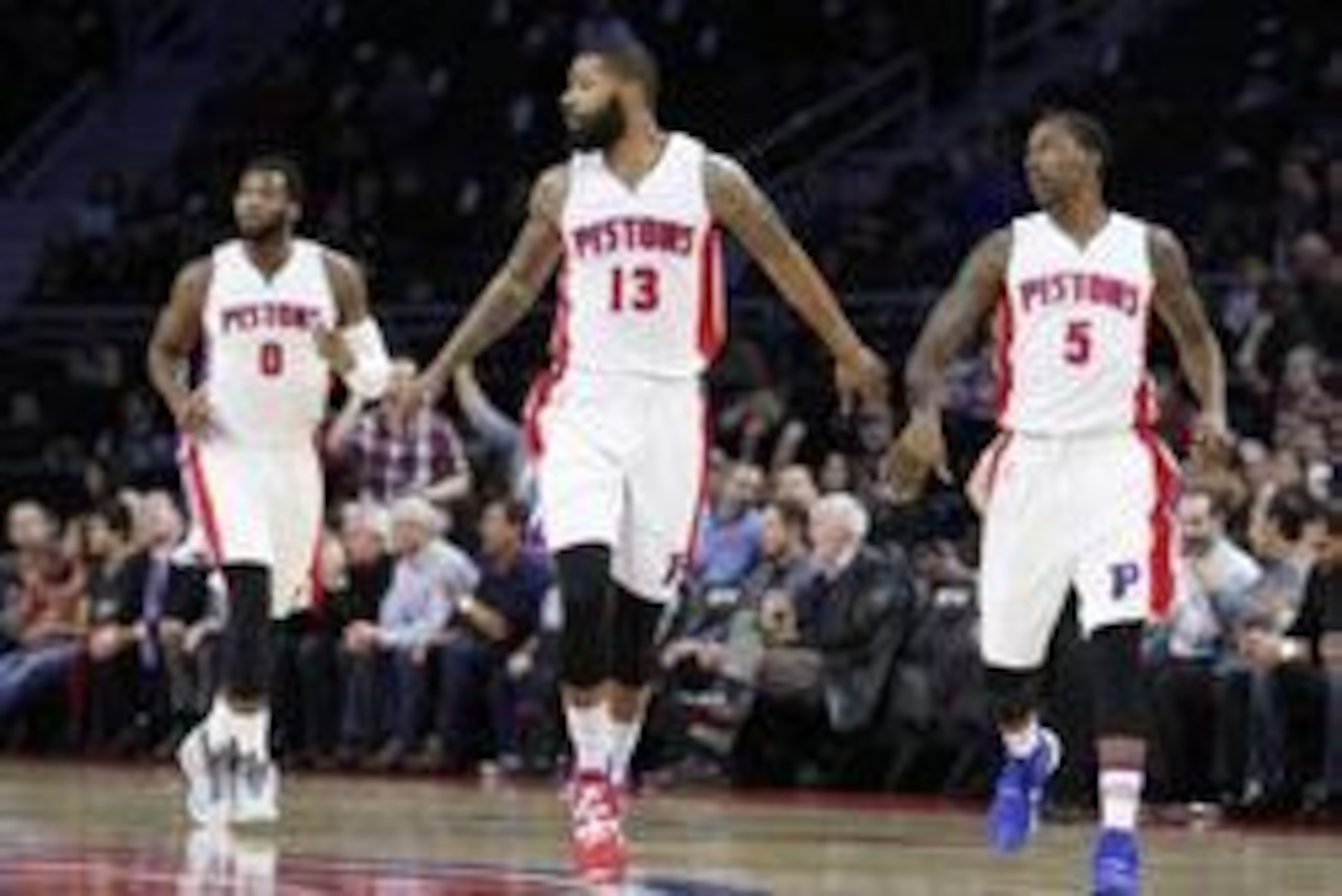 Mar 21, 2016; Auburn Hills, MI, USA; Detroit Pistons forward Marcus Morris (13) runs back down the court with guard Kentavious Caldwell-Pope (5) and center Andre Drummond (0) after making a shot during the first quarter against the Milwaukee Bucks at The 
