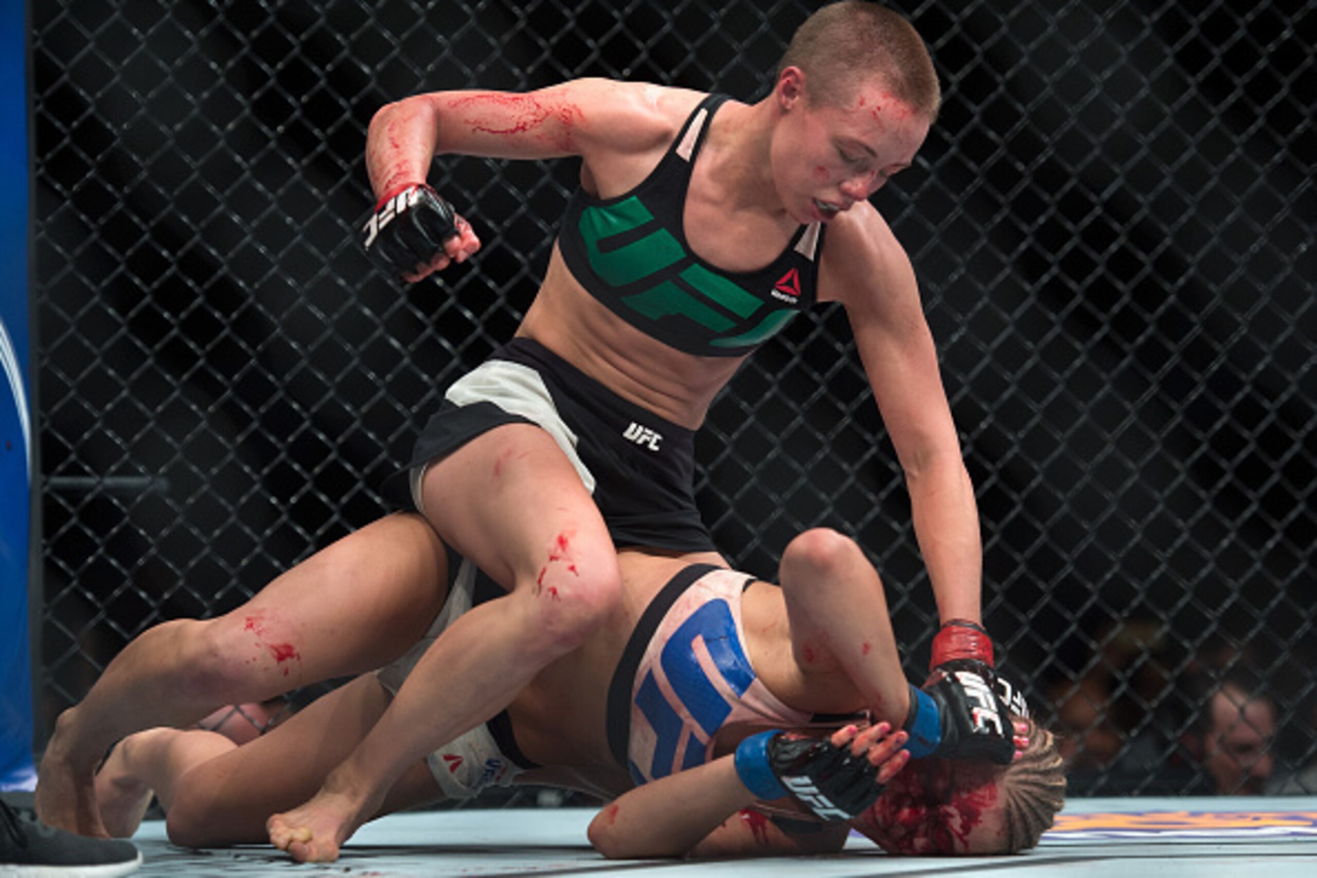 LAS VEGAS, NEVADA - DECEMBER 10:  (Top) Rose Namajunas punches Paige VanZant in their women's strawweight bout during the UFC Fight Night event at The Chelsea at the Cosmopolitan of Las Vegas on December 10, 2015 in Las Vegas, Nevada.  (Photo by Brandon M
