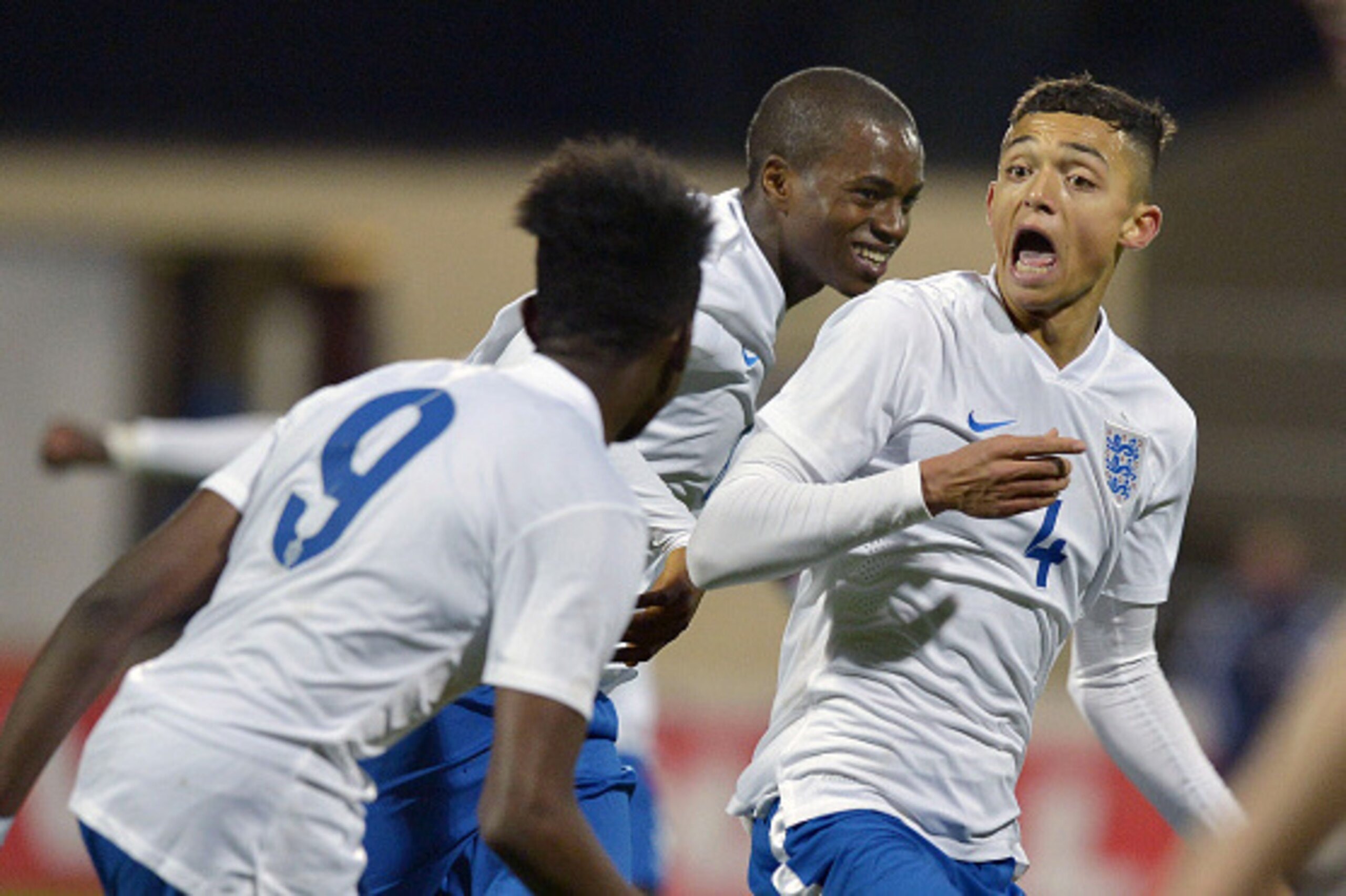 DUNGANNON, NORTHERN IRELAND - NOVEMBER 07: Andre Dozzell of England (R) celebrates scoring the opening goal during this evenings Sky Sports Victory Shield U16 international game between Northern Ireland and England at Stangmore Park on November 7, 2014 i DUNGANNON, NORTHERN IRELAND - NOVEMBER 07: Andre Dozzell of England (R) celebrates scoring the opening goal during this evenings Sky Sports Victory Shield U16 international game between Northern Ireland and England at Stangmore Park on November 7, 2014 i