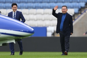 LEICESTER, ENGLAND - APRIL 03: Leicester City owner Vichai Srivaddhanaprabha waves as he heads towards his helicopter on the pitch after the Barclays Premier League match between Leicester City and Southampton at The King Power Stadium on April 3, 2016 in