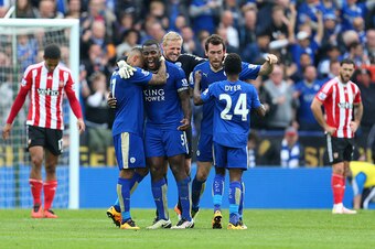 LEICESTER, ENGLAND - APRIL 03:  Goalscorer Wes Morgan of Leicester City celebrates with his team mates Danny Simpson, Kasper Schmeichel, Christian Fuchs and Nathan Dyer of Leicester City at the end of the Barclays Premier League match between Leicester Ci