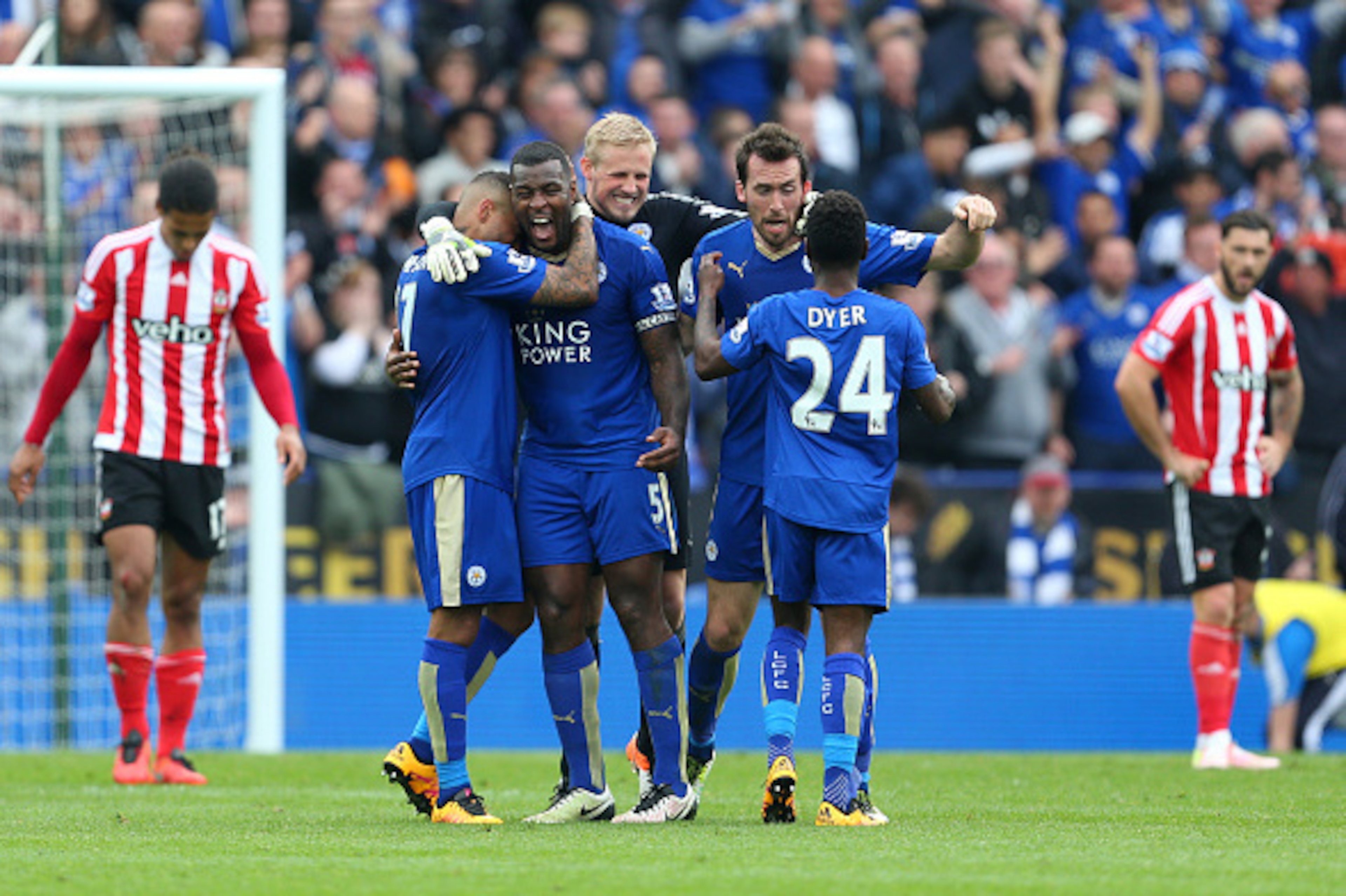 LEICESTER, ENGLAND - APRIL 03:  Goalscorer Wes Morgan of Leicester City celebrates with his team mates Danny Simpson, Kasper Schmeichel, Christian Fuchs and Nathan Dyer of Leicester City at the end of the Barclays Premier League match between Leicester Ci