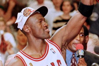 CHICAGO, UNITED STATES:  Chicago Bulls Michael Jordan celebrates after his team beat the Seattle SuperSonics 87-75 in game six of the NBA Finals at the United Center in Chicago, Illinois, 16 June.  The Bulls defeated the Seattle Supersonics to win the ser