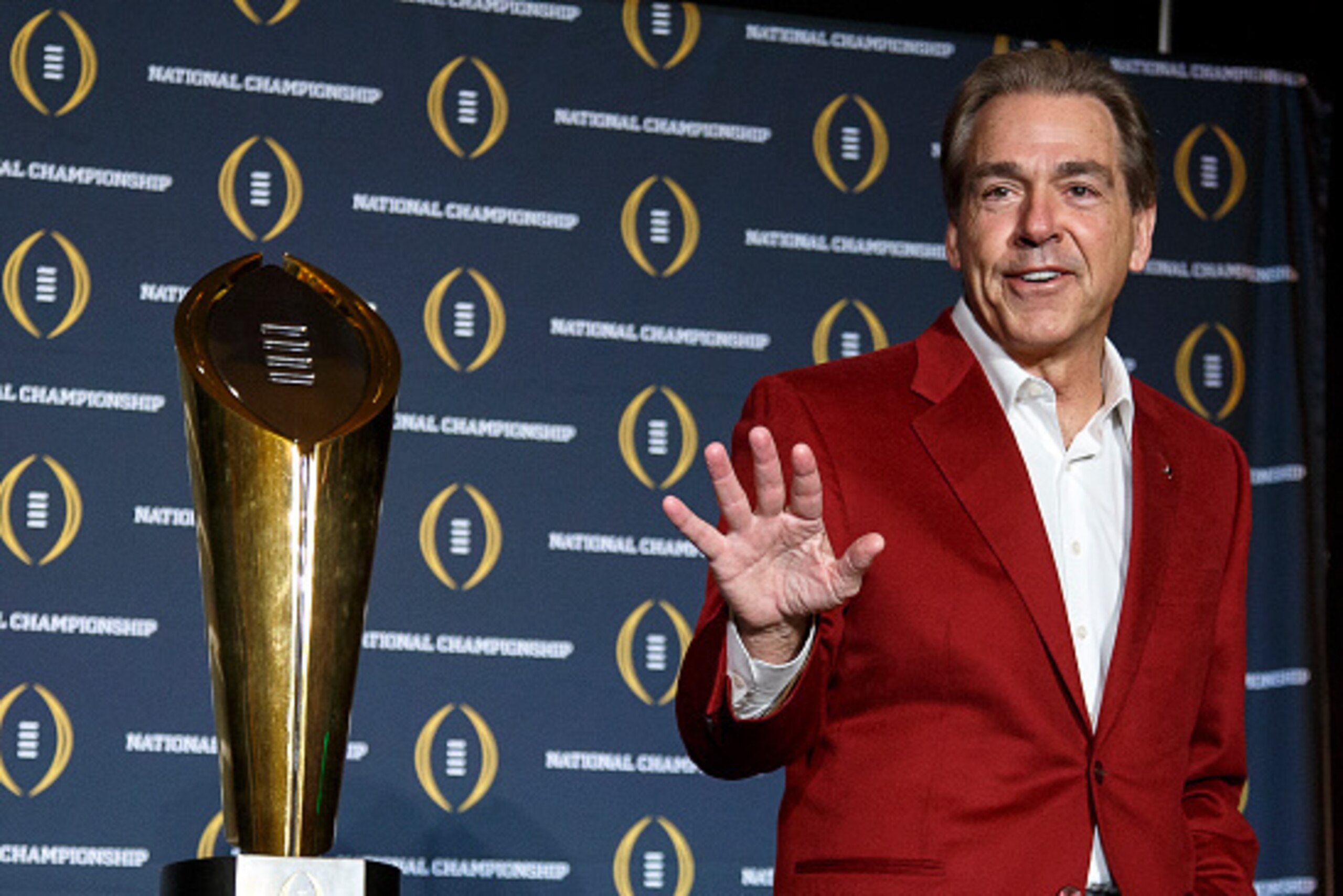 SCOTTSDALE, AZ - JANUARY 12: Head Coach Nick Saban of the Alabama Crimson Tide pose with the College Football Playoff National Championship Trophy during the MVP Press Conference after winning the College Football Playoff National Championship at the JW M