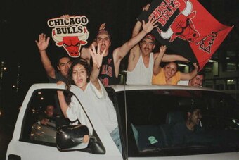 CHICAGO, IL - JUNE 16:  Chicago Bulls fans celebrate after game six of the NBA Finals at the United Center in Chicago, Illinois, 16 June.  The Bulls defeated the Seattle Supersonics 87-75 to win the series 4-2.  (Photo credit should read Tim ZINLINBACH/AF