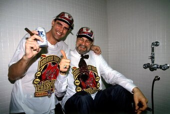CHICAGO - JUNE 16:  Jack Haley of the Chicago Bulls and Bulls head coach Phil Jackson celebrate winning the 1996 NBA Championship after defeating the Seattle SuperSonics in Game Six of the NBA Finals on June 16, 1996 at the United Center in Chicago, Illin