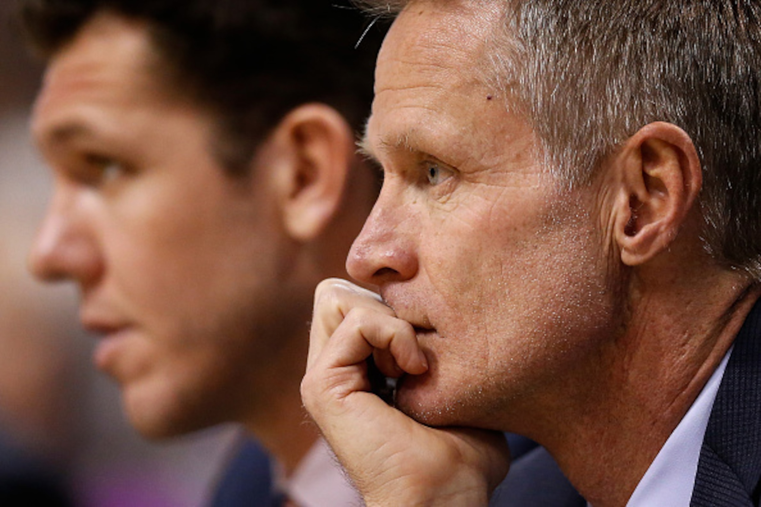 PHOENIX, AZ - FEBRUARY 10:  Head coach Steve Kerr (R) of the Golden State Warriors looks on from the bench alongside assistant coach Luke Walton during the NBA game against the Phoenix Suns at Talking Stick Resort Arena on February 10, 2016 in Phoenix, Ar