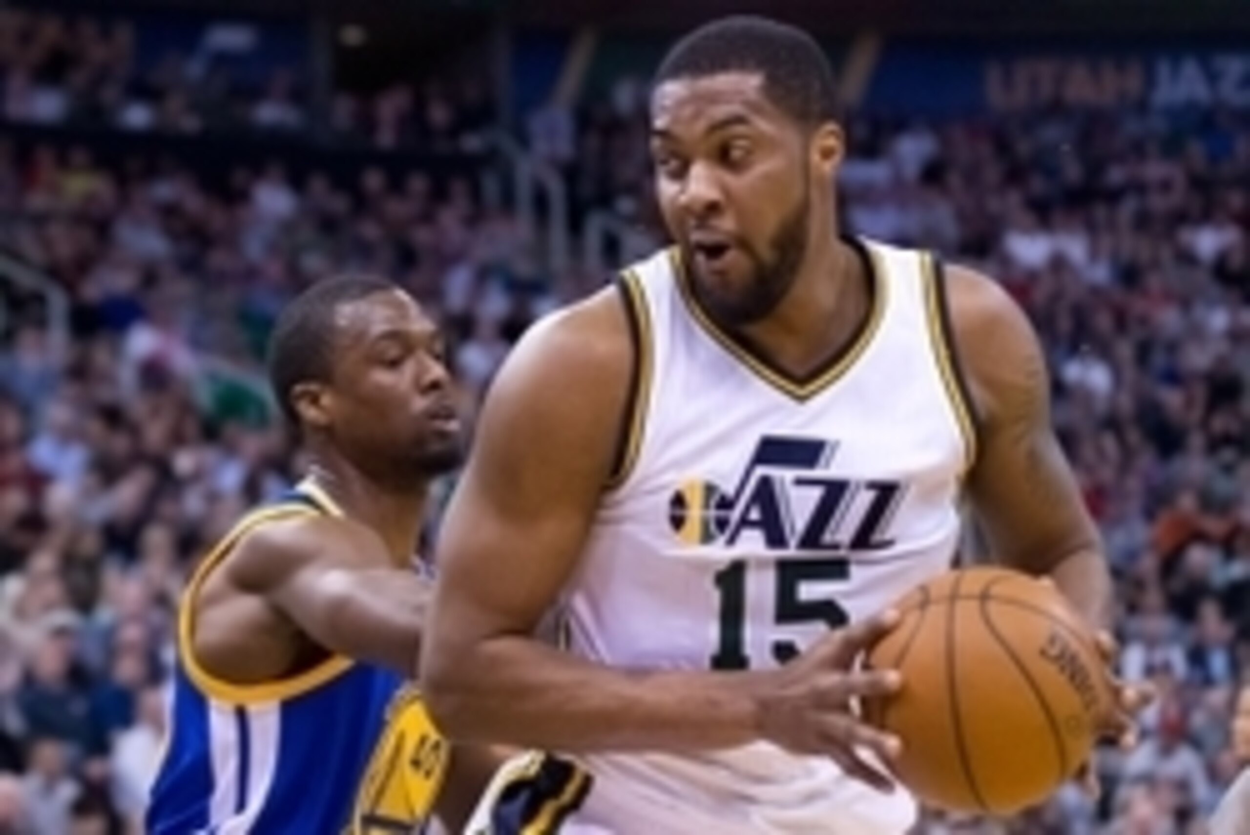 Mar 30, 2016; Salt Lake City, UT, USA; Golden State Warriors forward Harrison Barnes (40) defends against Utah Jazz forward Derrick Favors (15) during the first quarter at Vivint Smart Home Arena. Mandatory Credit: Russ Isabella-USA TODAY Sports