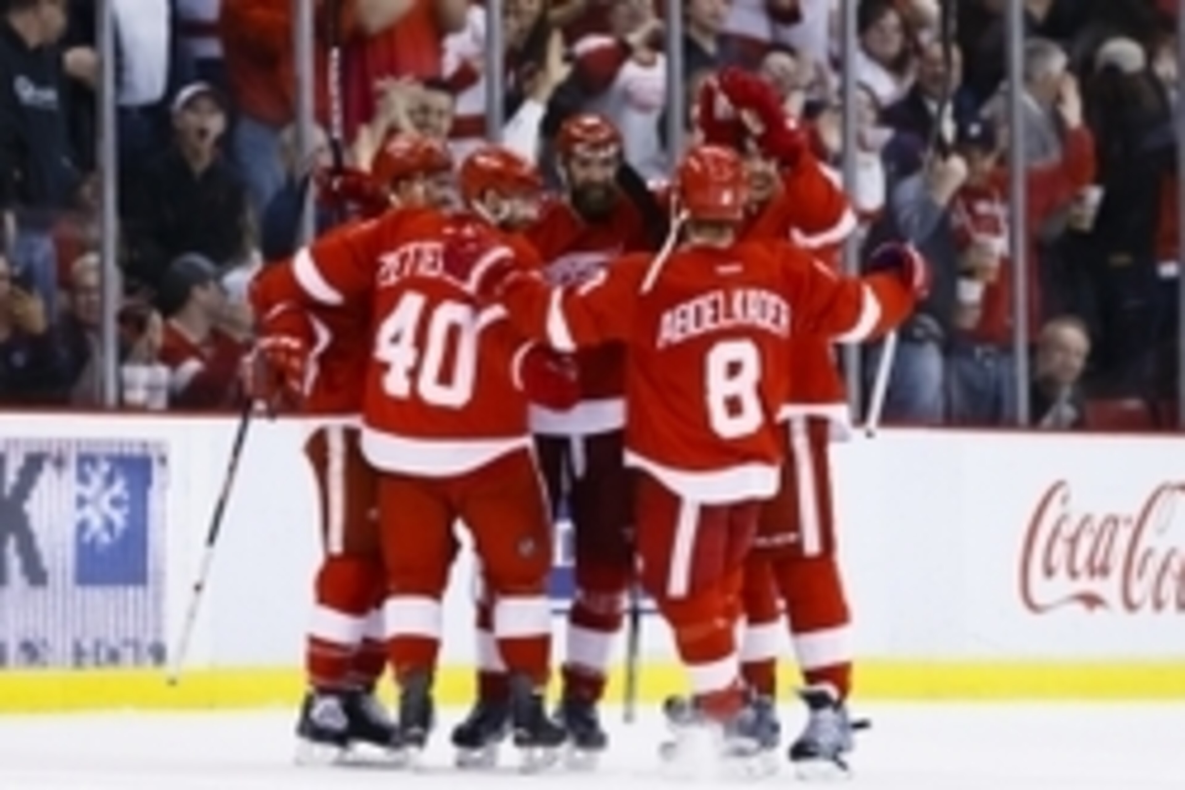 Apr 6, 2016; Detroit, MI, USA; Detroit Red Wings defenseman Kyle Quincey (center) receives congratulations from after scoring in the third period against the Philadelphia Flyers at Joe Louis Arena. Detroit won 3-0. Mandatory Credit: Rick Osentoski-USA TOD