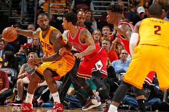 CLEVELAND, OH - MAY 12:  LeBron James #23 of the Cleveland Cavaliers posts up against Derrick Rose #1 of the Chicago Bulls in Game Five of the Eastern Conference Semifinals during the 2015 NBA Playoffs on May 12, 2015 at The Quicken Loans Arena in Clevela