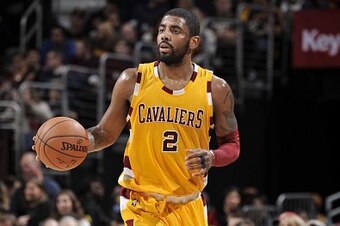 CLEVELAND, OH - APRIL 11:  Kyrie Irving #2 of the Cleveland Cavaliers brings the ball up court against the Atlanta Hawks on April 11, 2016 at Quicken Loans Arena in Cleveland, Ohio. NOTE TO USER: User expressly acknowledges and agrees that, by downloading