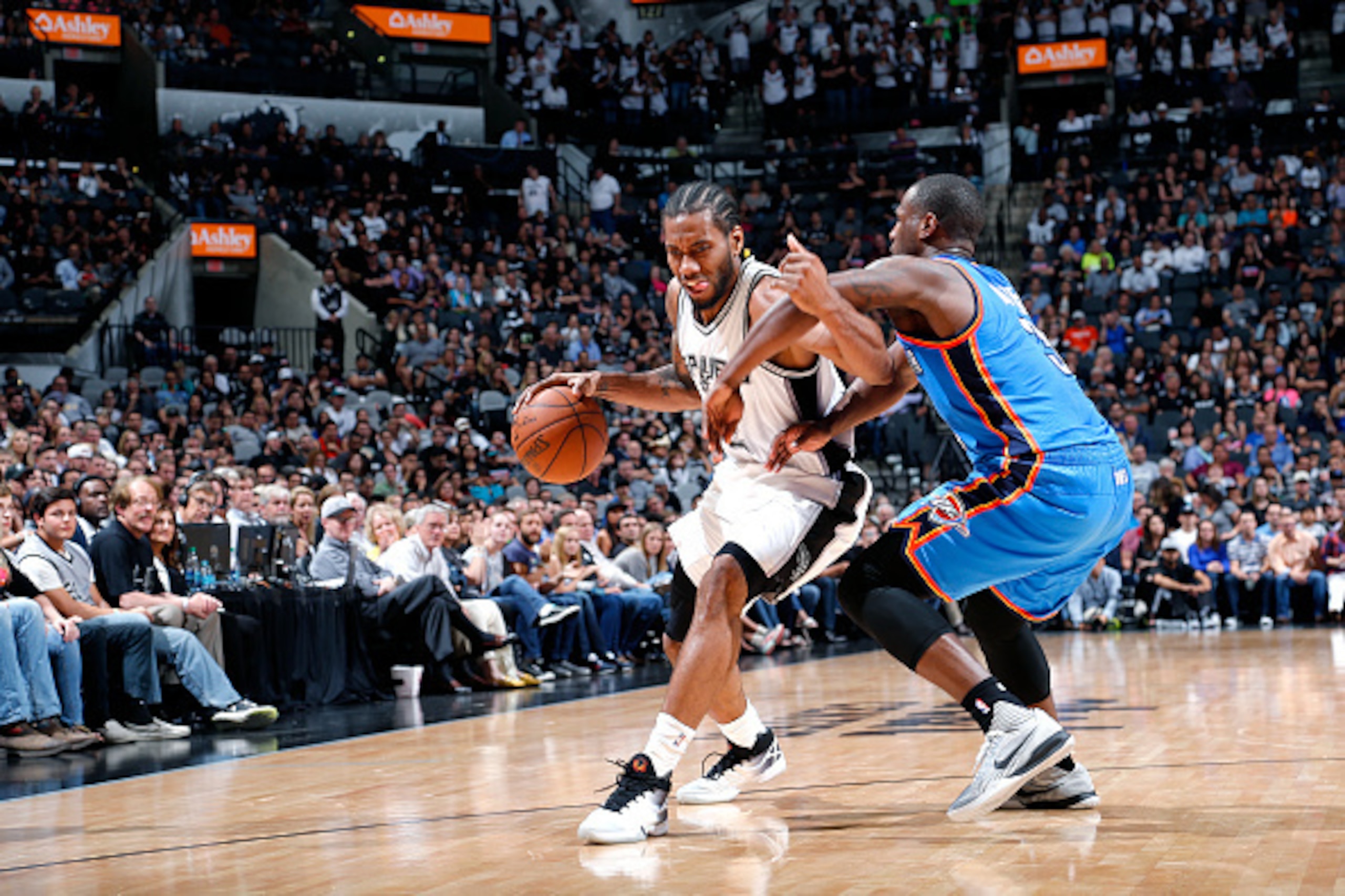 SAN ANTONIO, TX - APRIL 12: Kawhi Leonard #2 of the San Antonio Spurs handles the ball during the game against the Oklahoma City Thunder on April 12, 2016 at the AT&T Center in San Antonio, Texas. NOTE TO USER: User expressly acknowledges and agrees that,