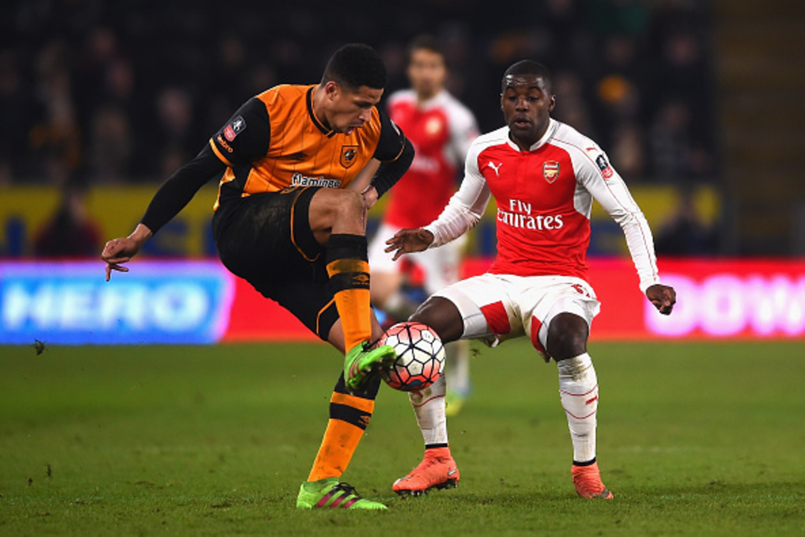 HULL, ENGLAND - MARCH 08: Curtis Davies of Hull City is closed down by Joel Campbell of Arsenal during the Emirates FA Cup Fifth Round Replay match between Hull City and Arsenal at KC Stadium on March 8, 2016 in Hull, England.  (Photo by Laurence Griffith