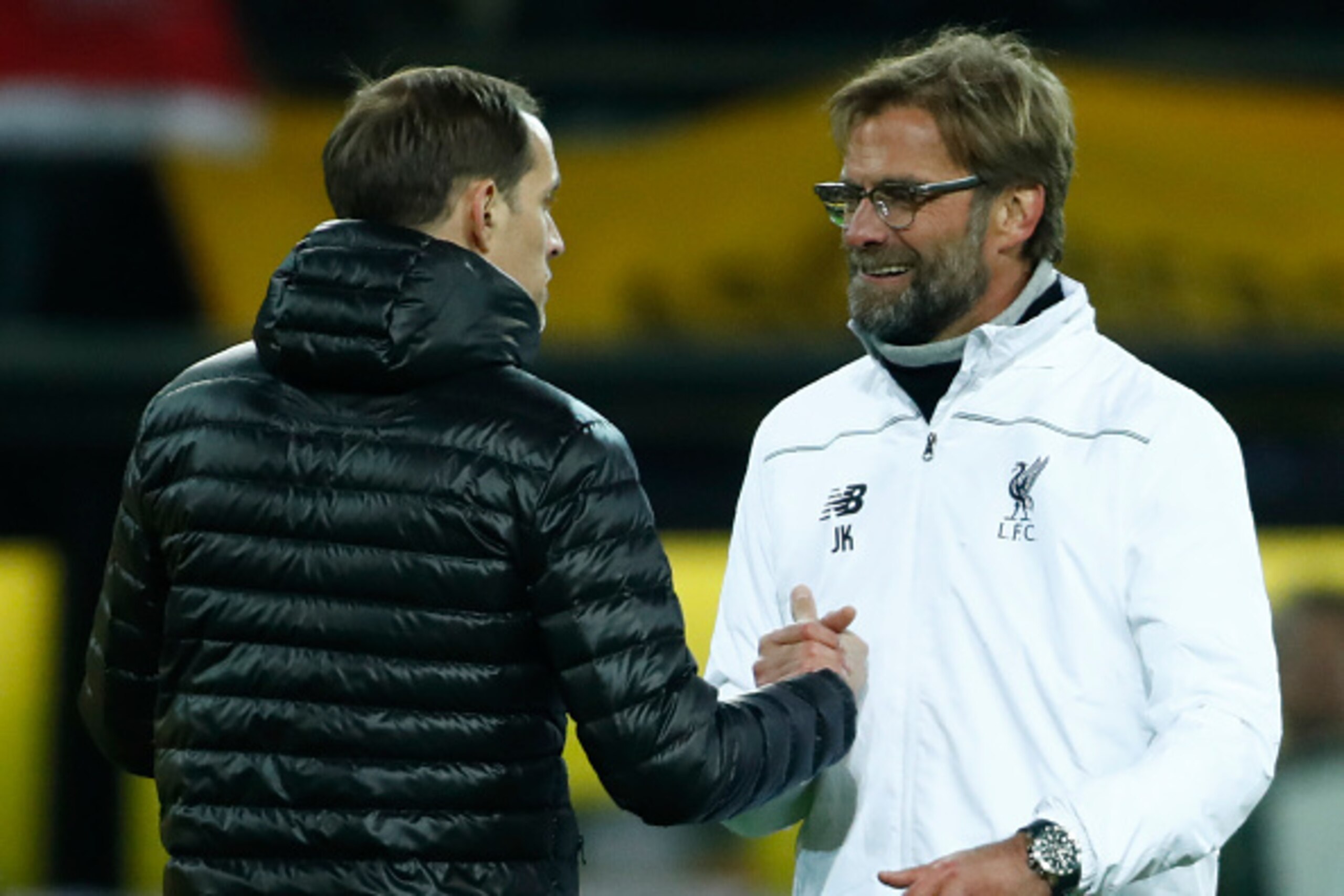 Dortmund's head coach Thomas Tuchel (L) and Liverpool's German head coach Jurgen Klopp shake hands after the UEFA Europe League quarter-final, first-leg football match Borussia Dortmund vs Liverpool FC in Dortmund, western Germany on April 7, 2016.
The ma
