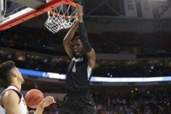 Mar 17, 2016; Raleigh, NC, USA; Providence Friars forward Ben Bentil (0) dunks the ball in front of USC Trojans forward Bennie Boatwright (25) during the first half at PNC Arena. Mandatory Credit: Geoff Burke-USA TODAY Sports