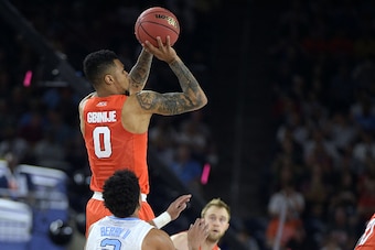 HOUSTON, TX - APRIL 02: Michael Gbinije #0 of the Syracuse Orange puts up a shot against the North Carolina Tar Heels during the 2016 NCAA Men's Final Four Semifinal at NRG Stadium on April 02, 2016 in Houston, Texas. North Carolina won 83-66. (Photo by L