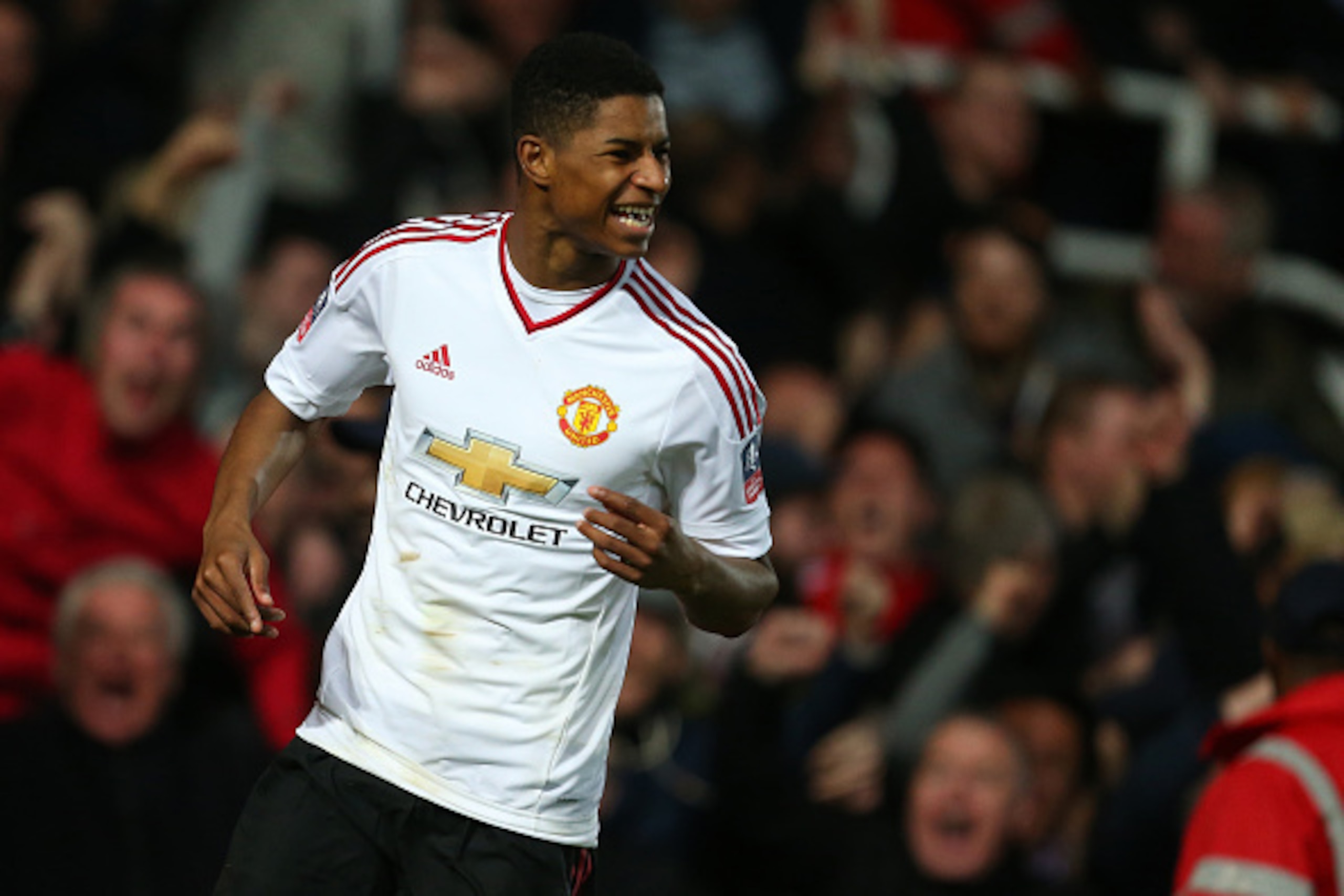 LONDON, ENGLAND - APRIL 13: Marcus Rashford of Manchester United celebrates after he scores to make it 0-1 during the Emirates FA Cup Sixth Round Replay match between West Ham United and Manchester United at Boleyn Ground on April 13, 2016 in London, Engl