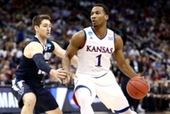 Mar 26, 2016; Louisville, KY, USA; Kansas Jayhawks guard Wayne Selden Jr. (1) drives to the basket against Villanova Wildcats guard Ryan Arcidiacono (15) during the second half of the south regional final of the NCAA Tournament at KFC YUM!. Mandatory Cred