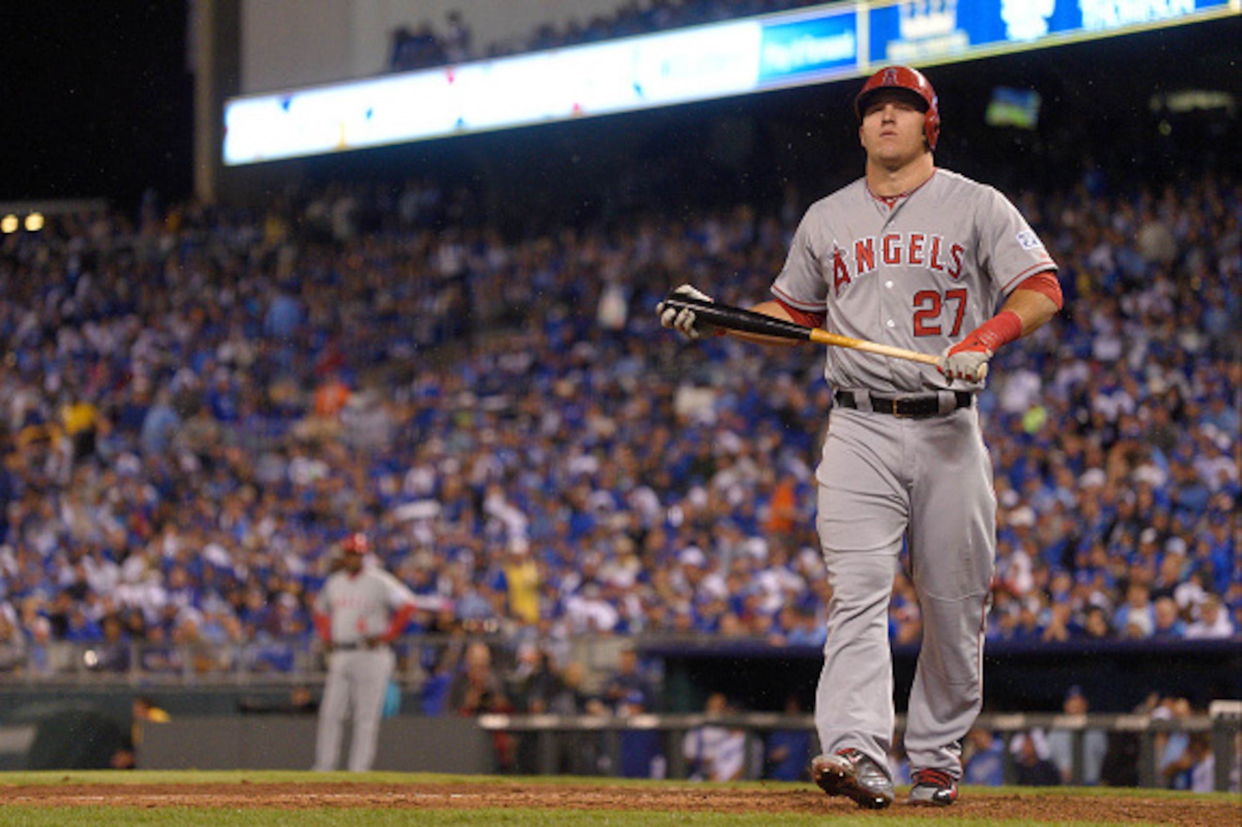 ANAHEIM, CA - OCTOBER 5: Mike Trout #27 of the Los Angeles Angels of Anaheim walks towards the dugout after striking out during game 3 of the American League Division Series against the Kansas City Royals on October 5, 2014 at Kauffman Stadium in Kansas C