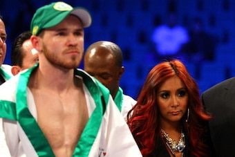 LAS VEGAS, NV - DECEMBER 08:  TV personality  Nicole 'Snooki' Polizzi, who is the promoter for boxer (L) Patrick Hyland , stands in the ring before Hyland takes on Javier Fortuna during their WBA interim featherweight title fight at the MGM Grand Garden A
